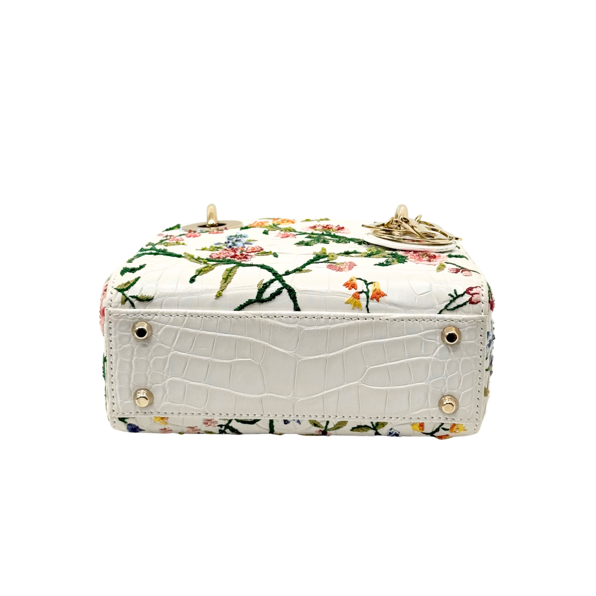 White floral mini handbag base with gold studs and patterned back panel