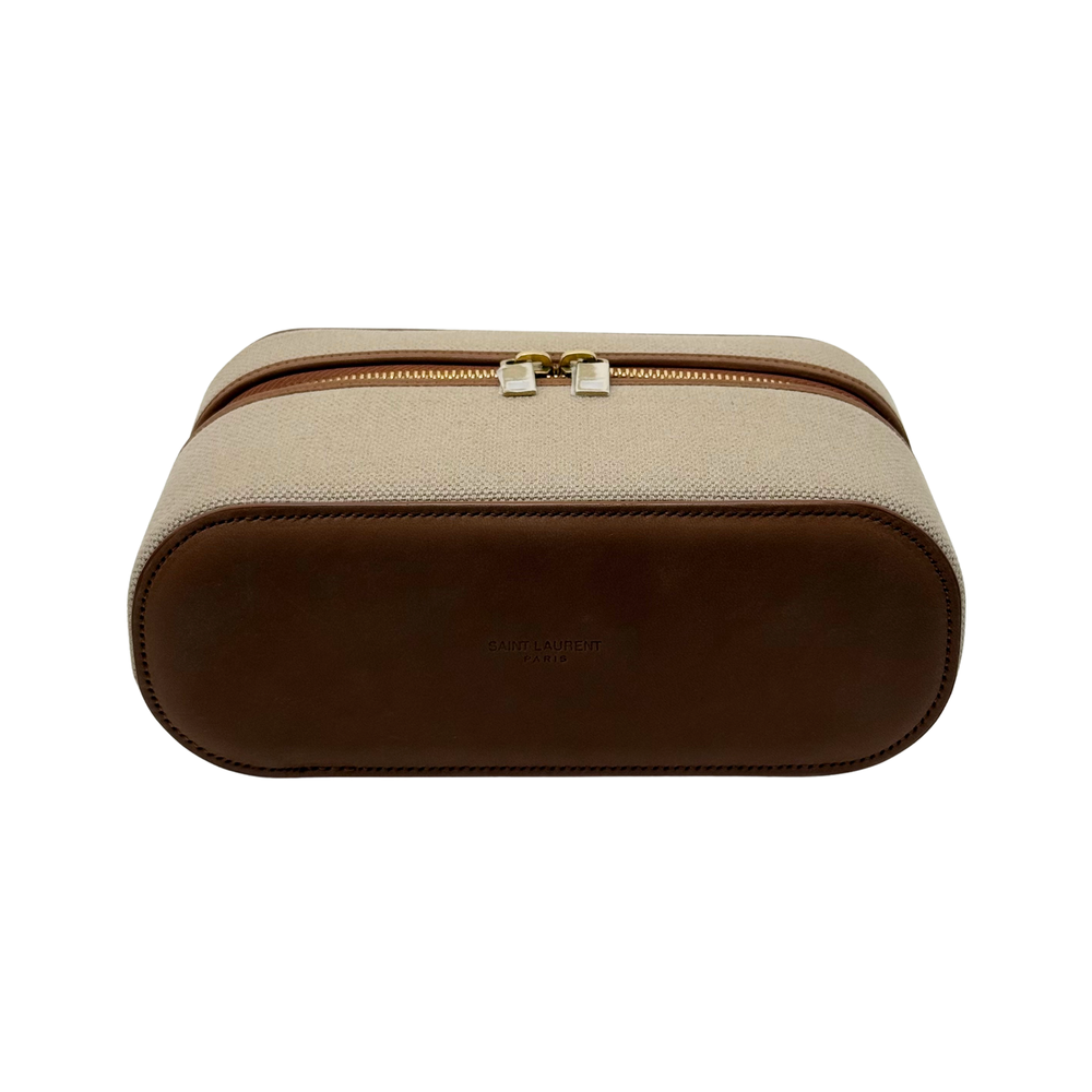 Beige canvas cosmetic case with brown leather trim and top handle, double zipper.