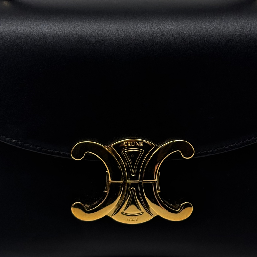 Gold-tone Celine Paris C logo on black leather flap