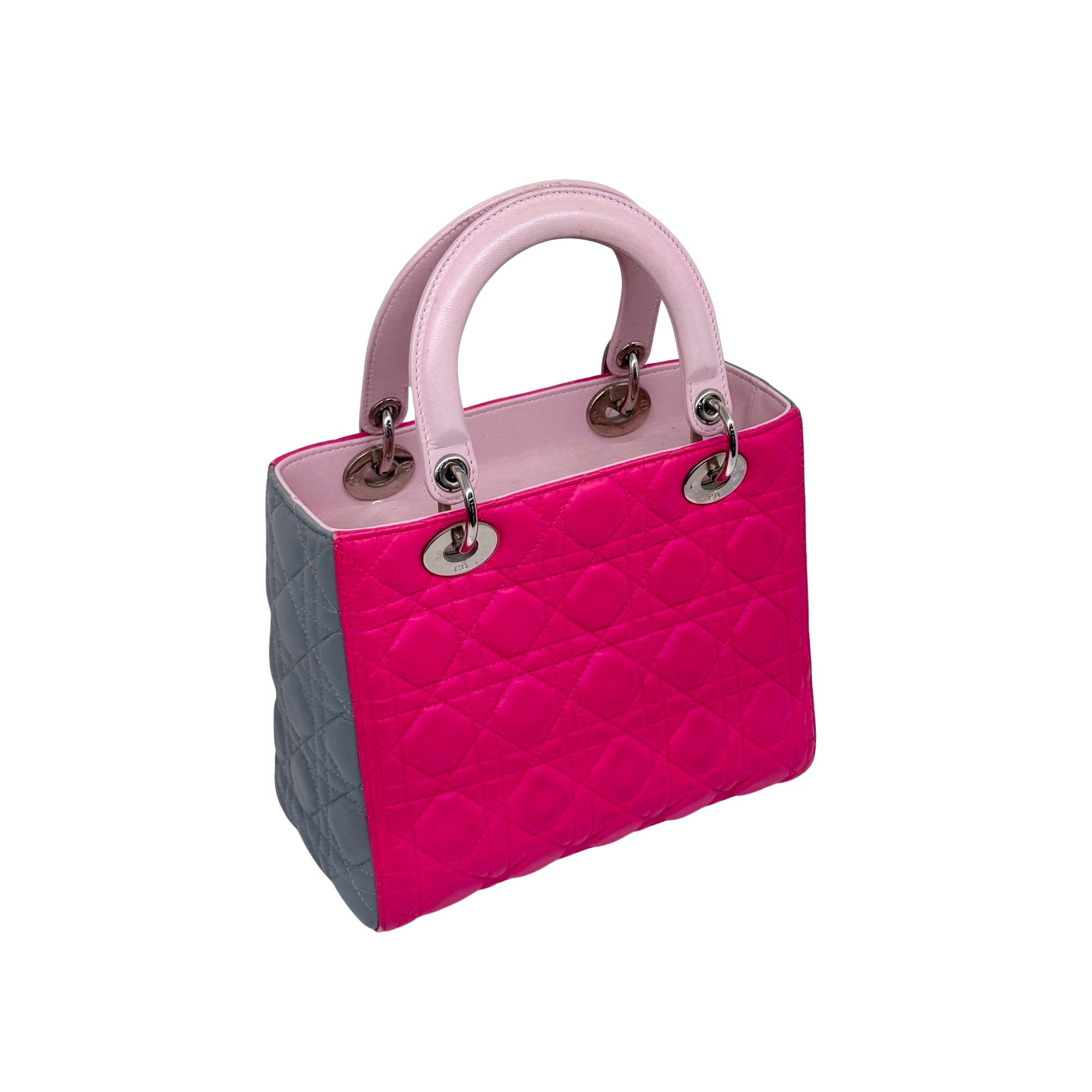 Two-tone quilted tote bag with top handles, pink front and gray sides, small hardware