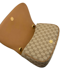 Gucci monogram shoulder bag with tan leather flap and gold-tone snap hardware