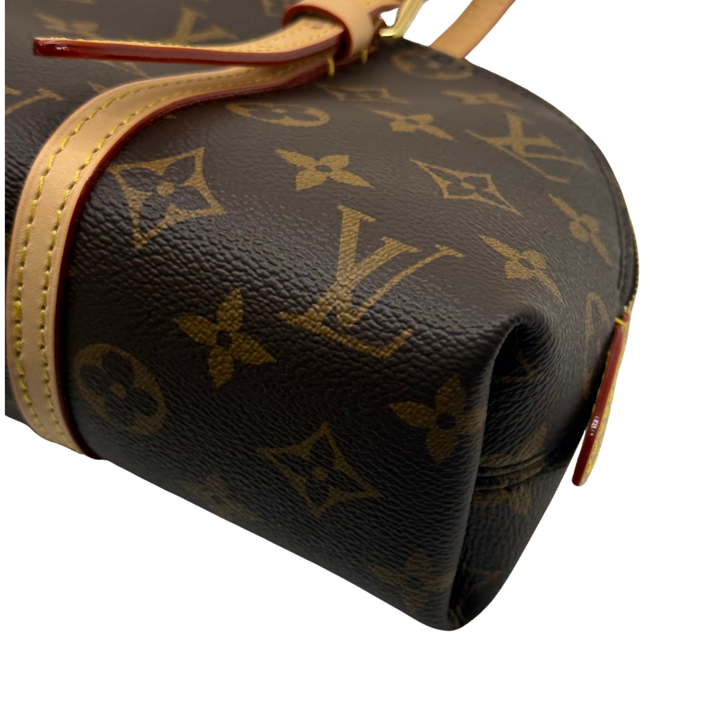 Louis Vuitton monogram bag with tan trim and red-edged accent