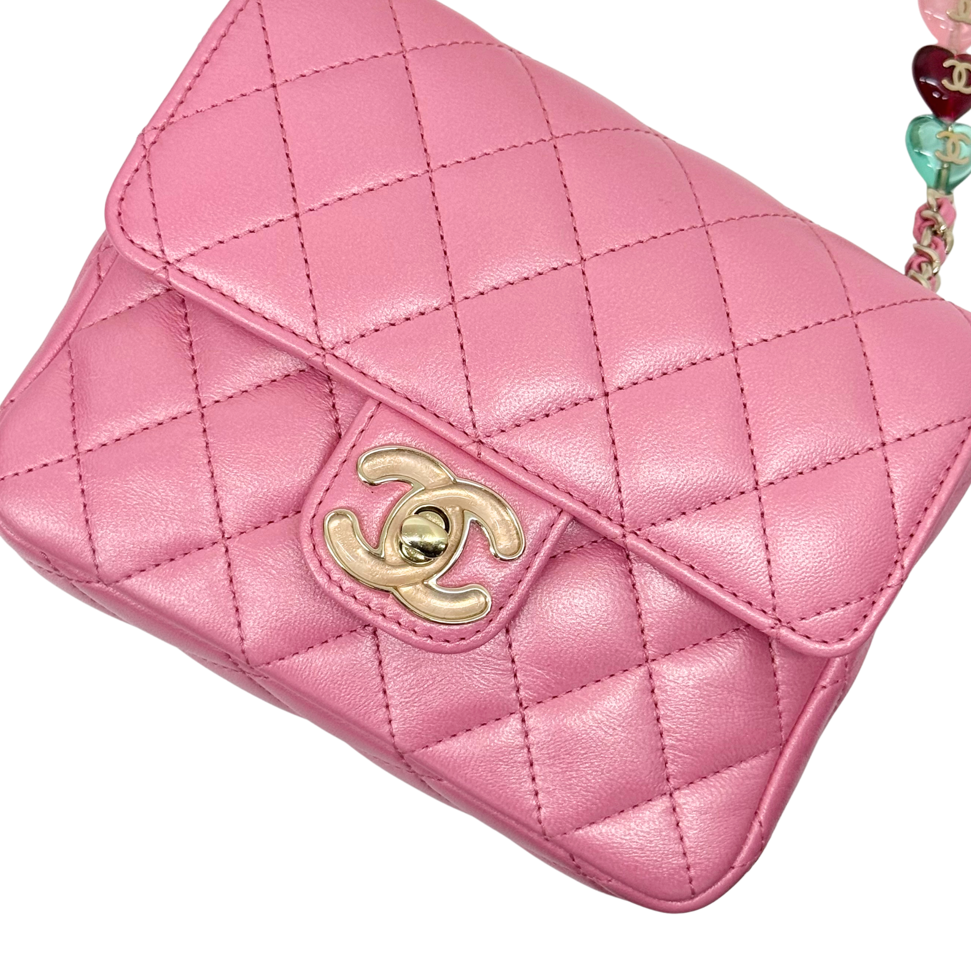 Pink quilted leather mini bag front with gold CC logo clasp