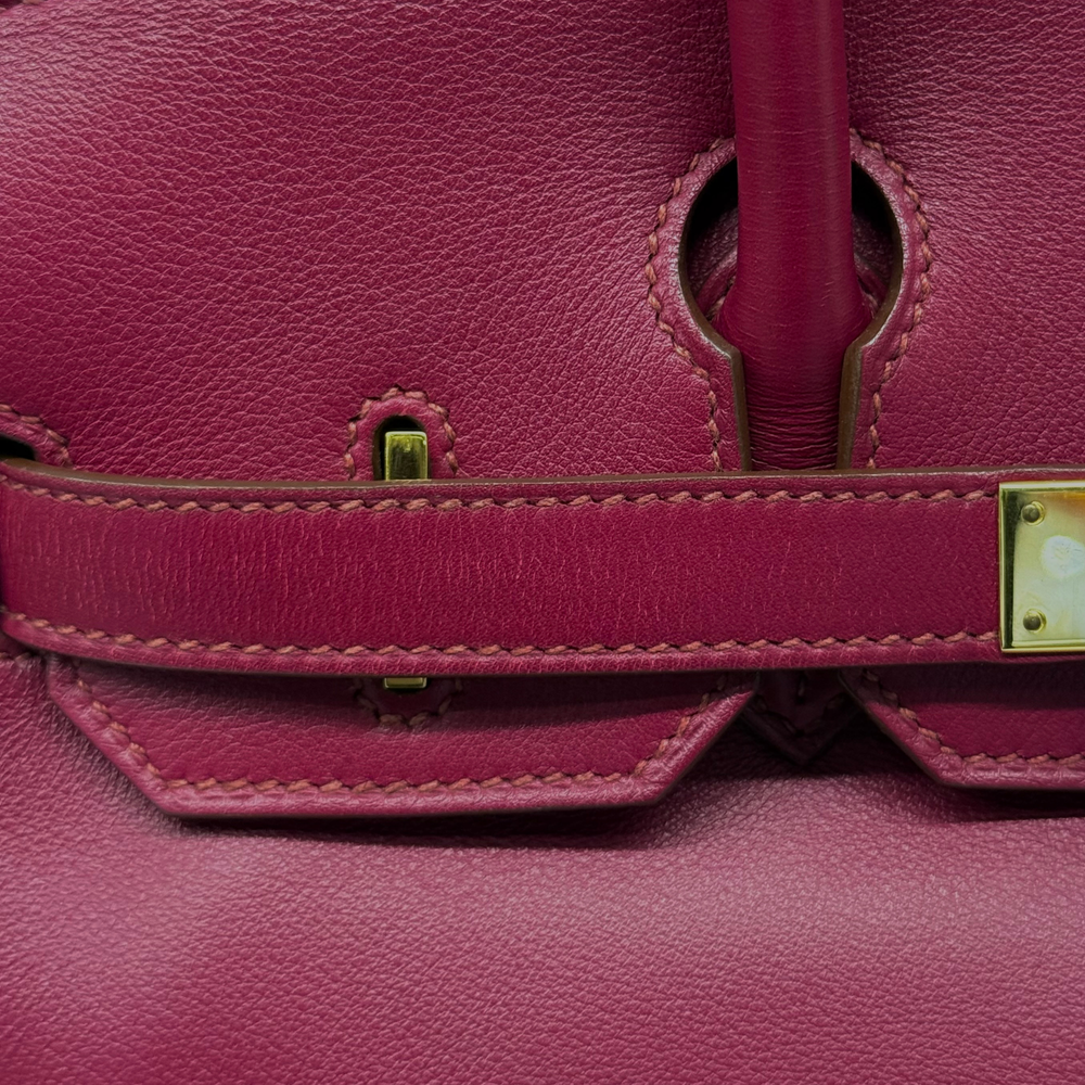 Hermès Birkin 30 magenta leather bag close-up of strap and turn-lock hardware