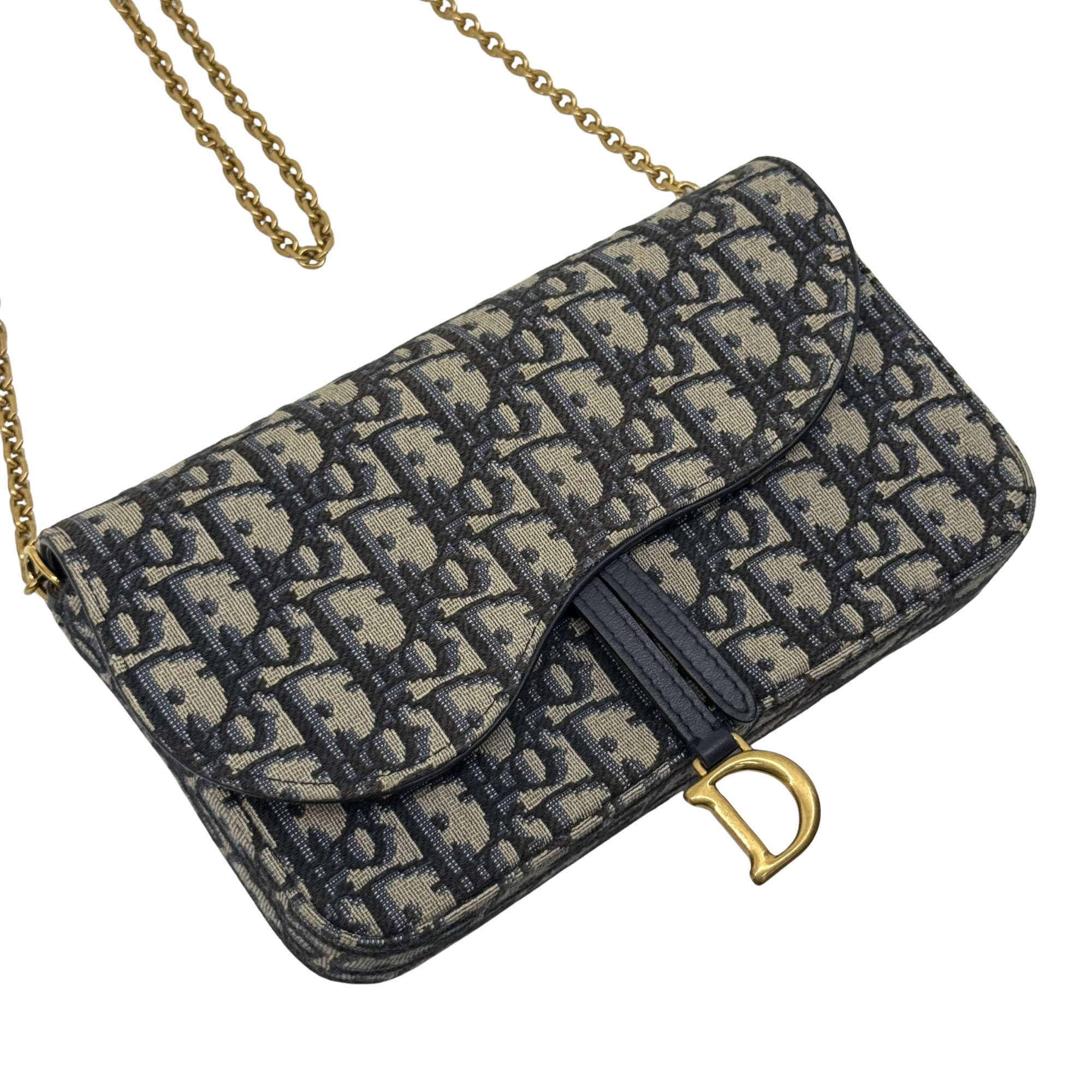 Dior monogram canvas crossbody bag with flap, black leather trim, and gold chain handle