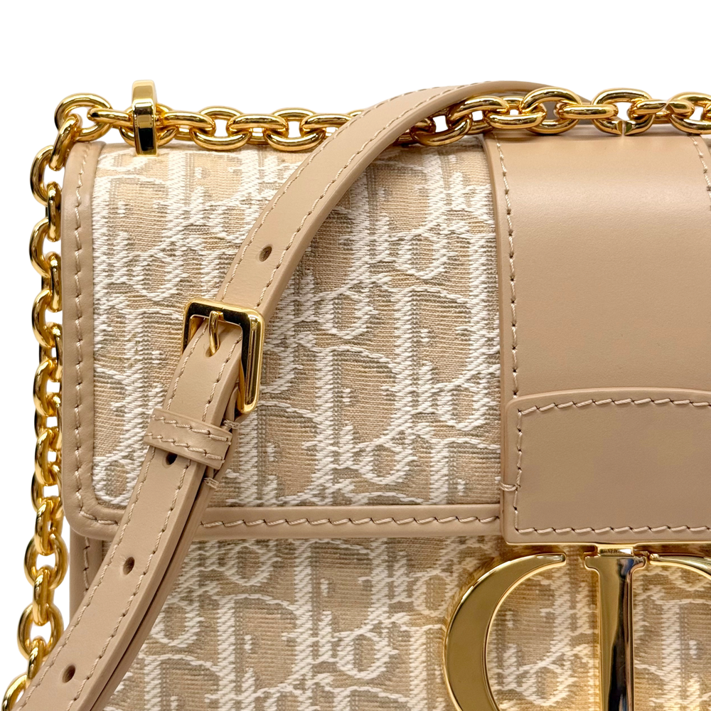 Dior pre-owned crossbody bag with beige monogram canvas, gold buckle, and chain strap