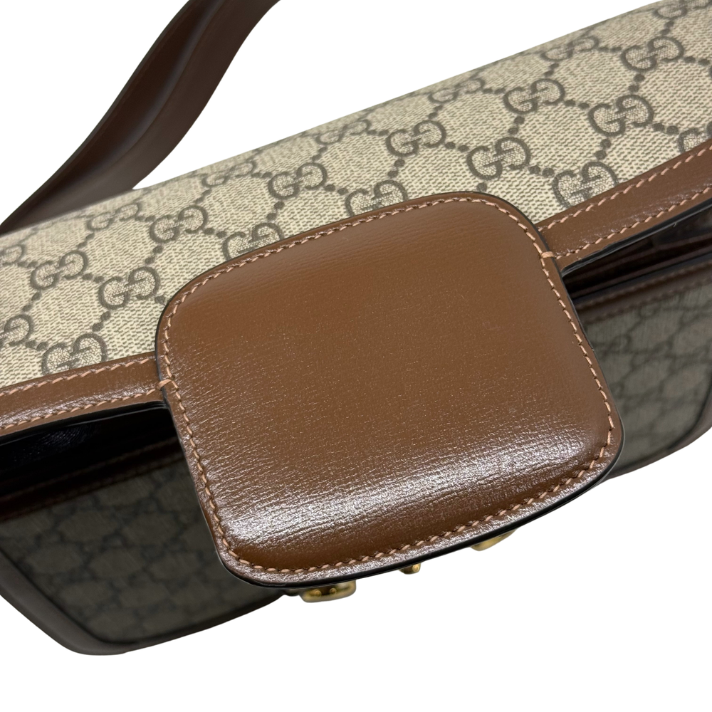 Pre-owned Gucci bag corner with brown leather trim and GG canvas panel