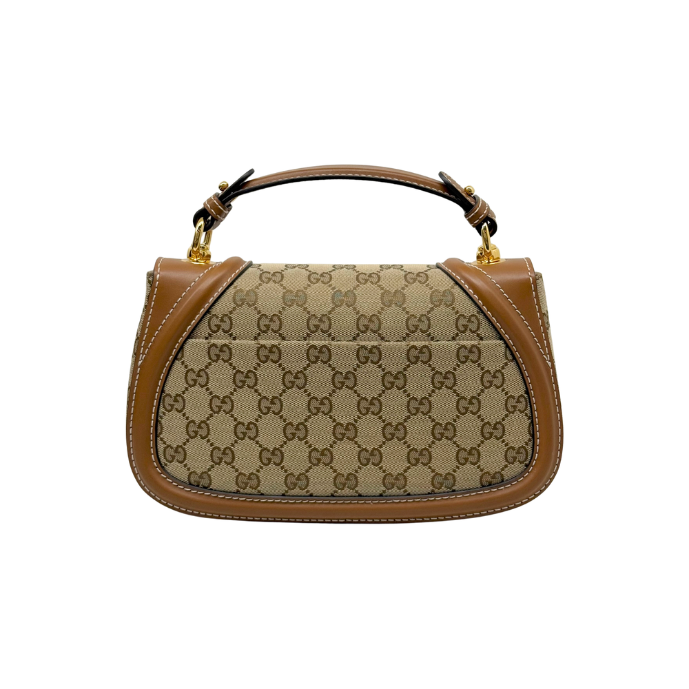Monogram canvas mini shoulder bag with tan leather handles and contrast trim