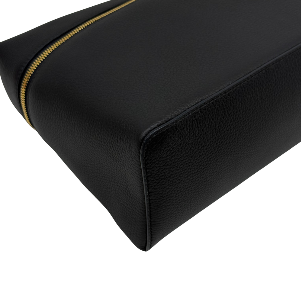 Black leather corner with gold zipper trim