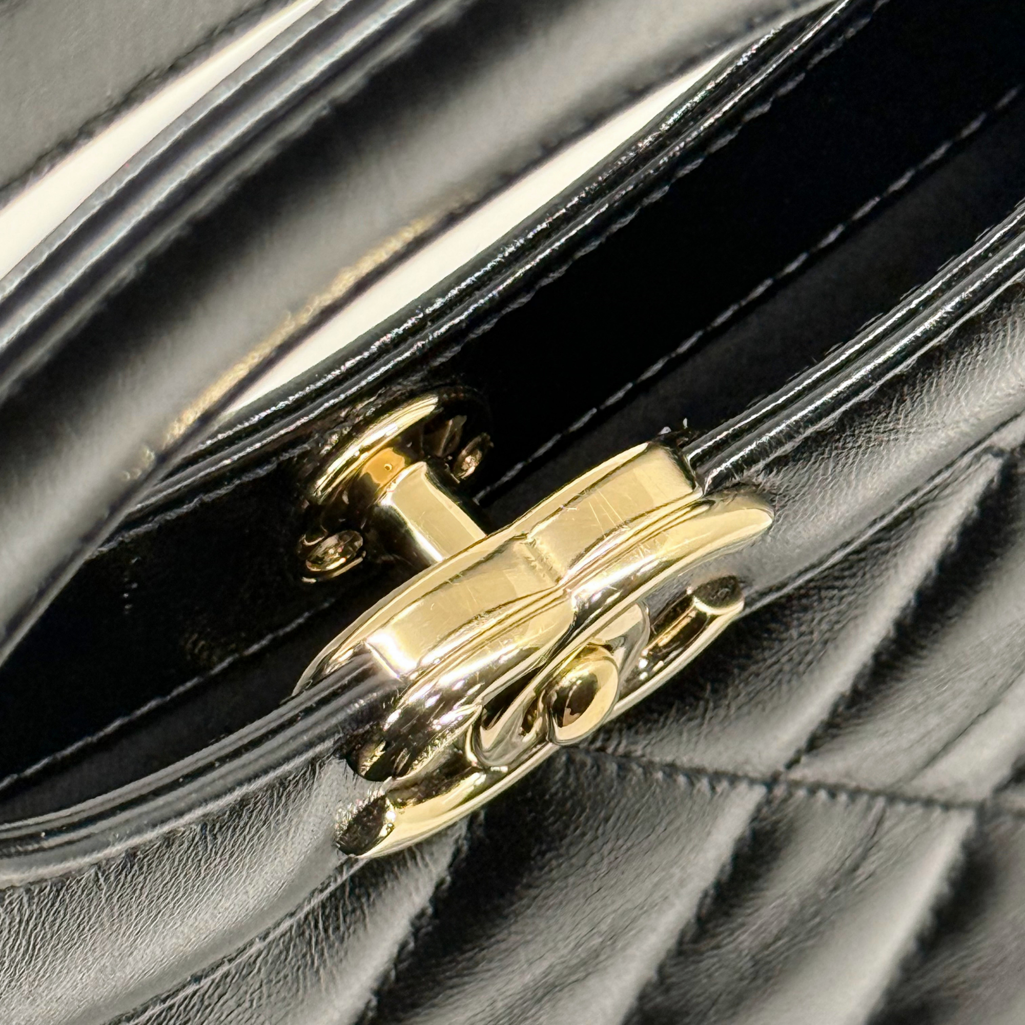 Chanel black bag leather handle