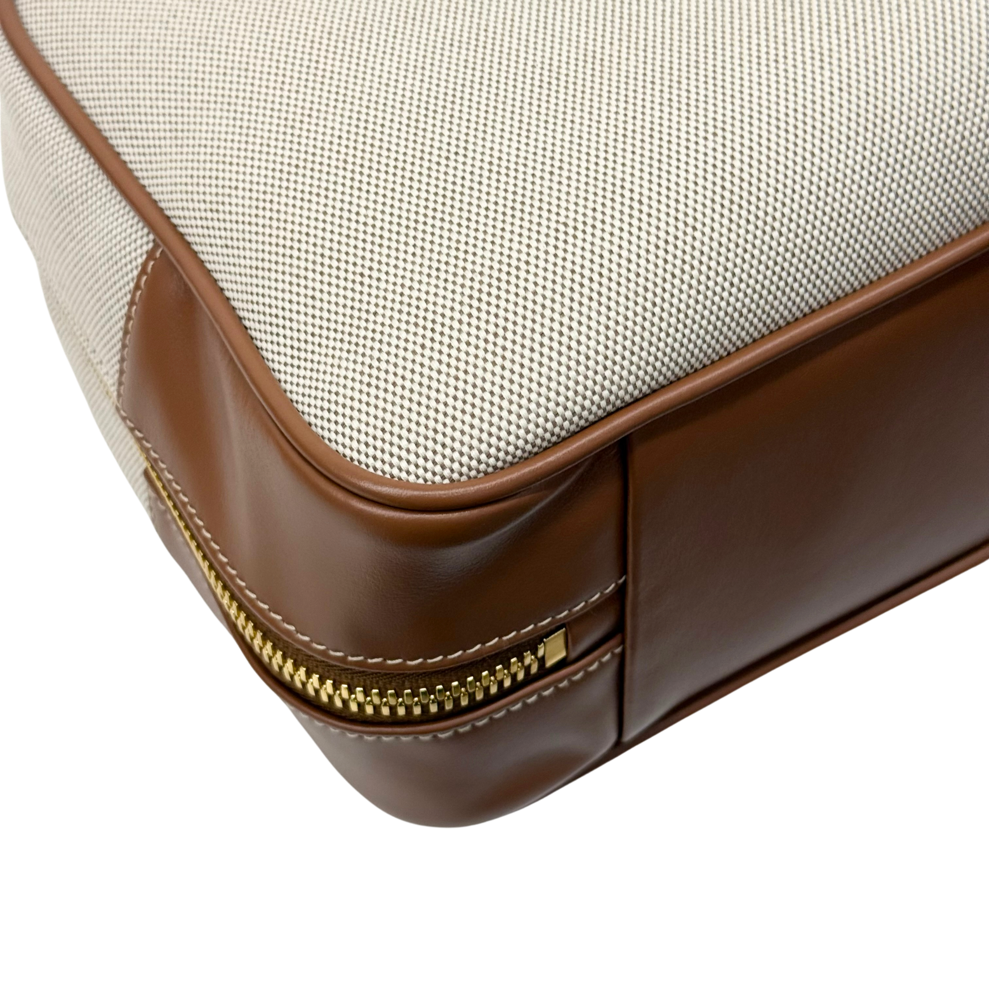 Miu Miu duffel bag corner with brown leather base and gold zipper