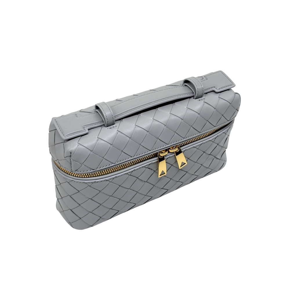 Bottega Veneta gray woven leather zip top bag with short handle and gold hardware.