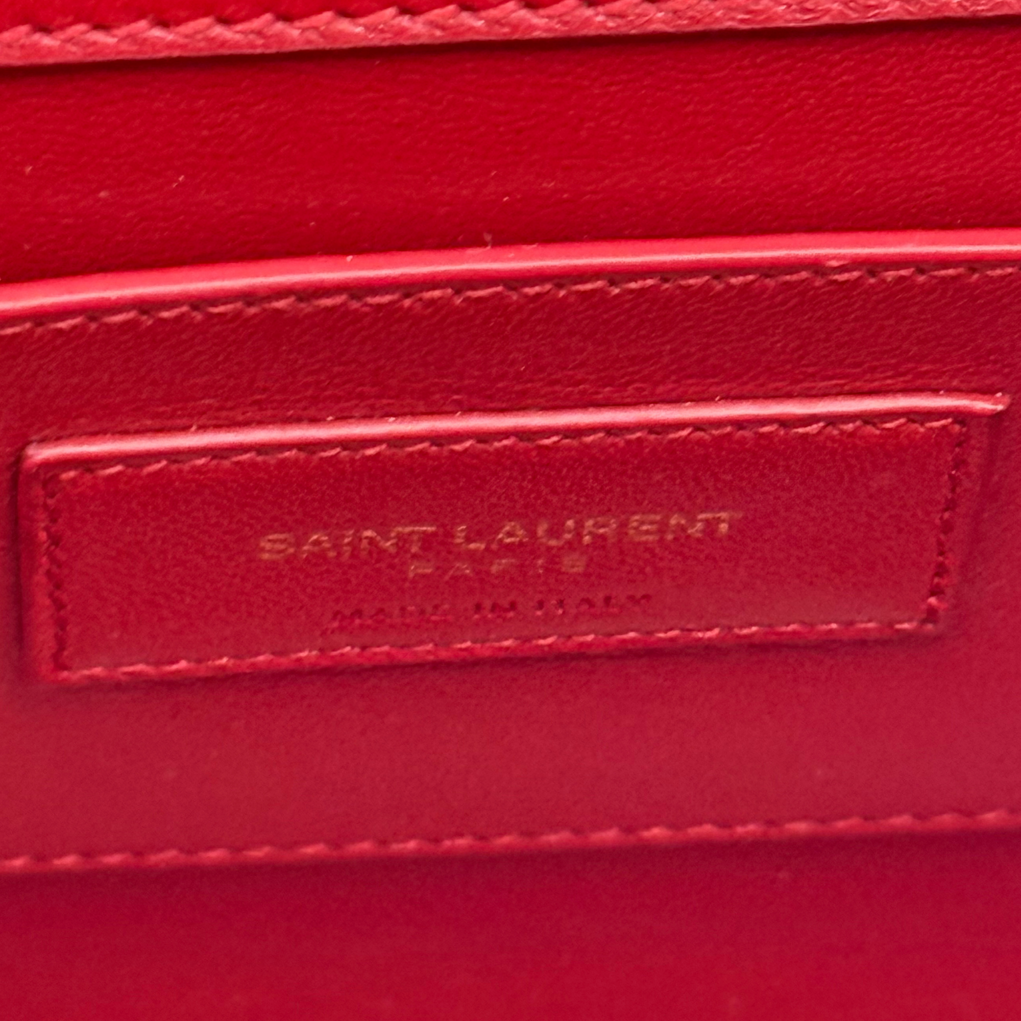Red leather flap clutch with SAINT LAURENT logo emboss on rectangular patch
