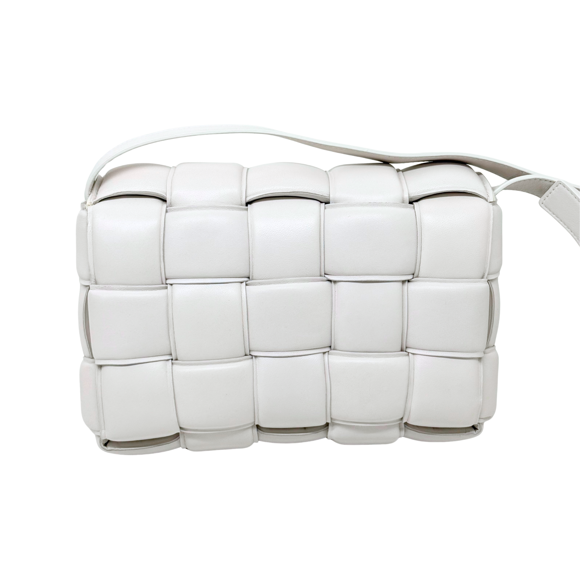 White leather crossbody bag with braided-style paneling and curved top handle