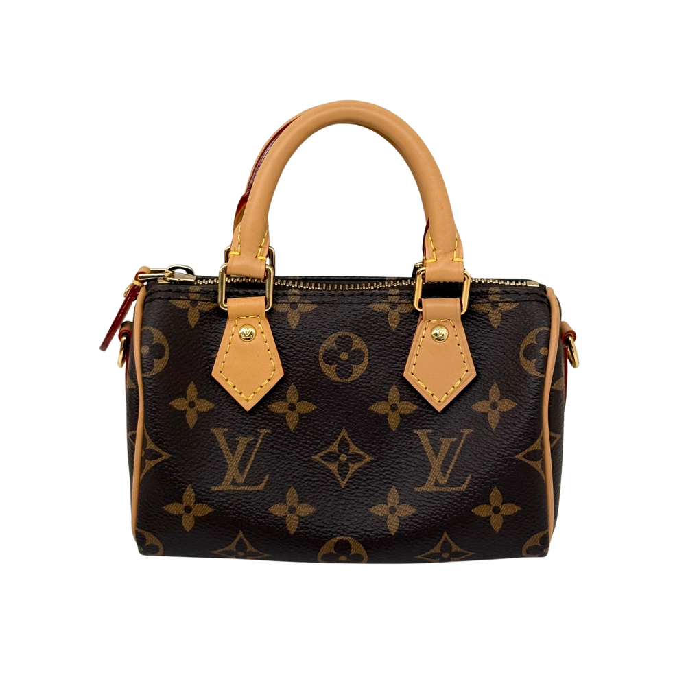 Monogram handbag with short handles and zip top, side view