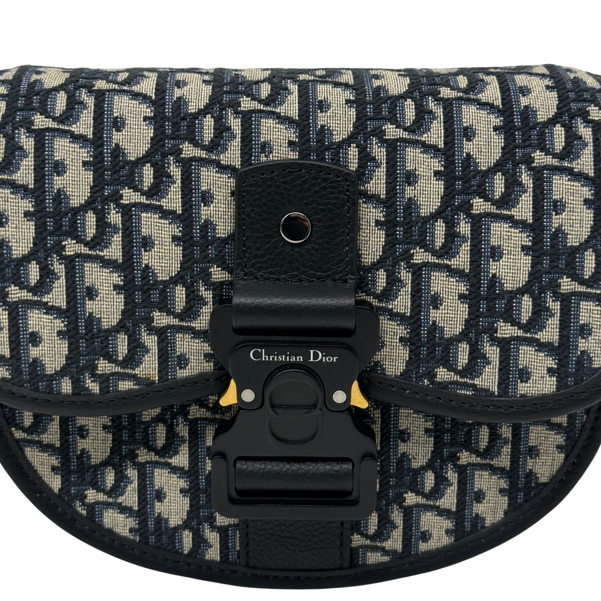 Dior patterned flap with black leather buckle and centered clasp hardware