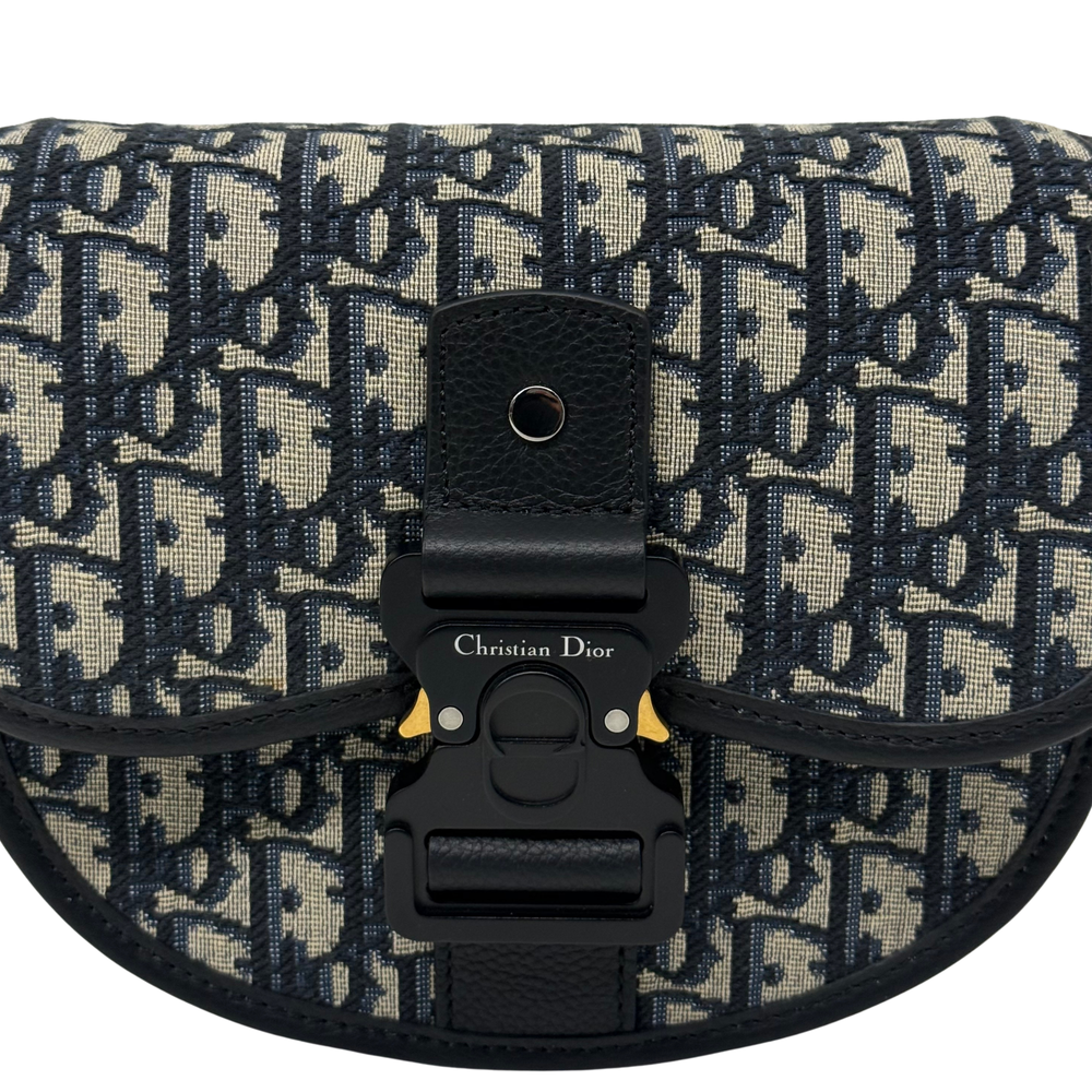 Dior patterned flap with black leather buckle and centered clasp hardware