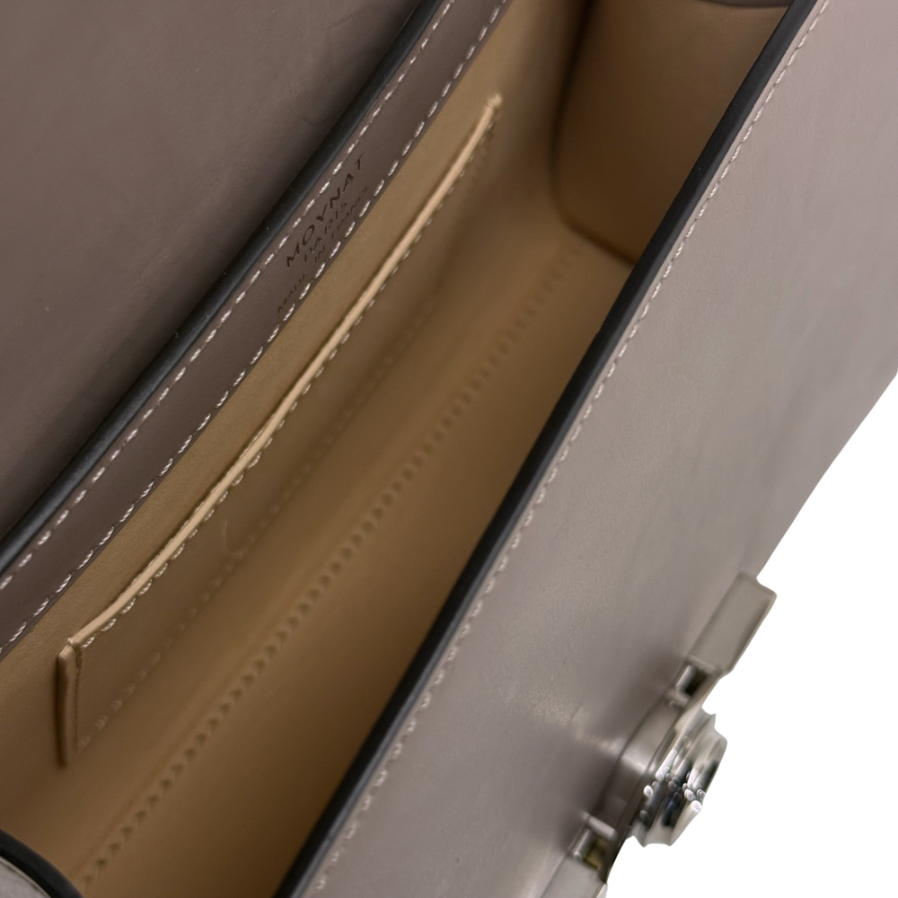 Moynat taupe leather handbag interior with stitched divider and slim pocket