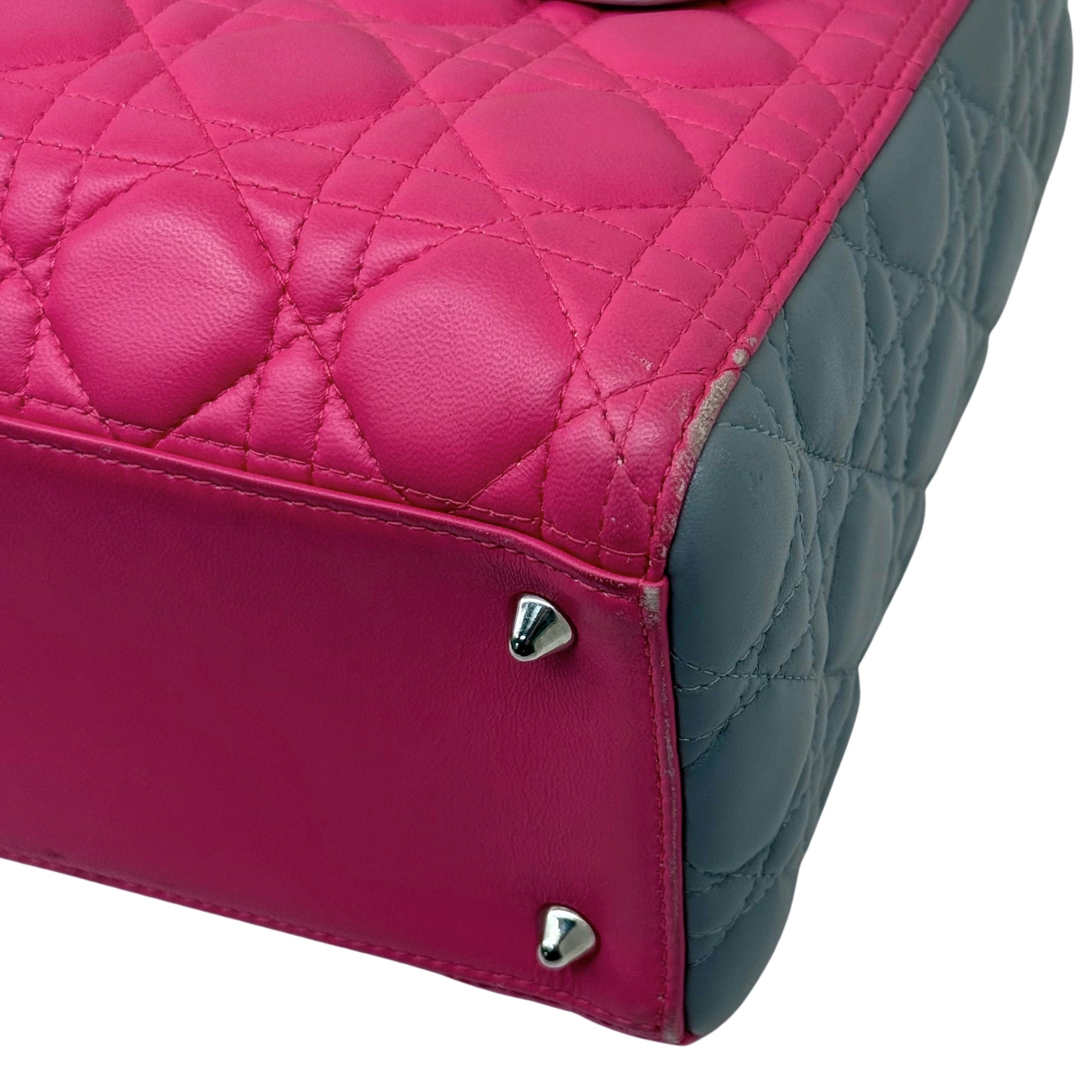 Quilted tote bag side panel with pink leather and gray contrast, metal stud details