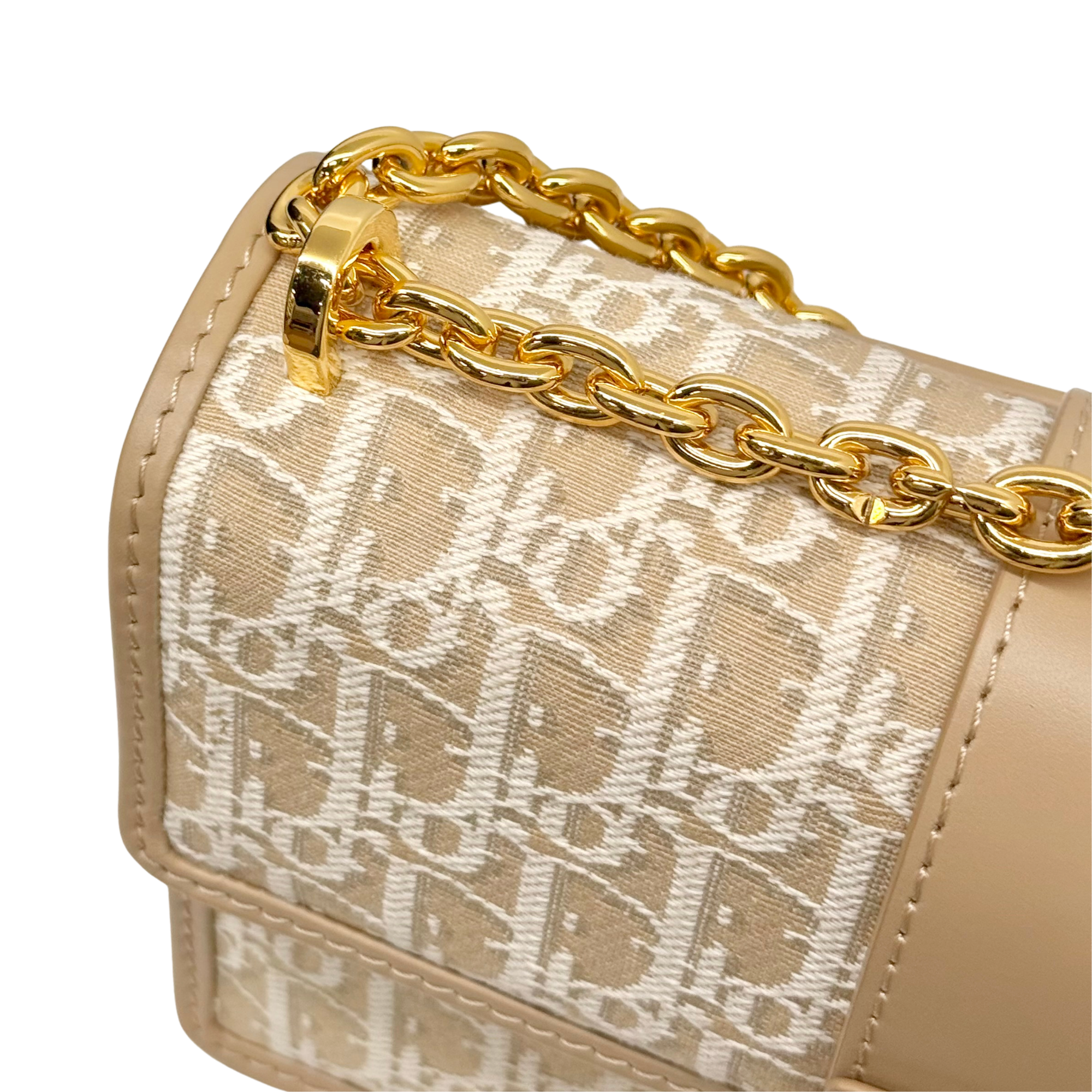 Dior pre-owned top corner view with beige monogram canvas and gold chain link