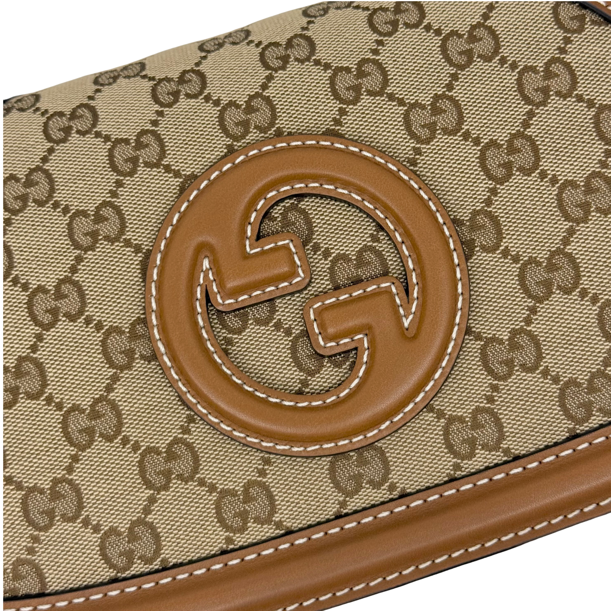 Gucci GG canvas flap with brown leather interlocking G logo patch