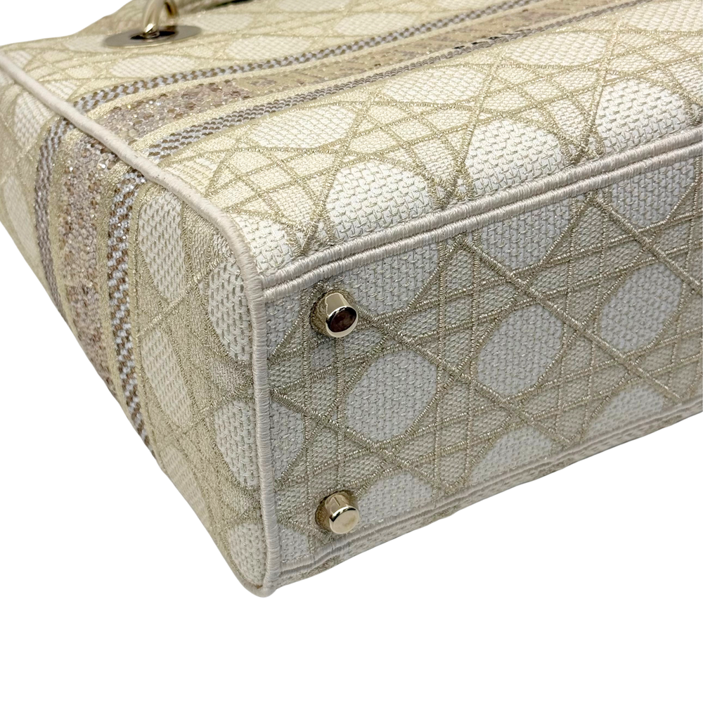 Christian Dior Medium Lady D-Lite bag close-up of front panel, beige embroidered canvas
