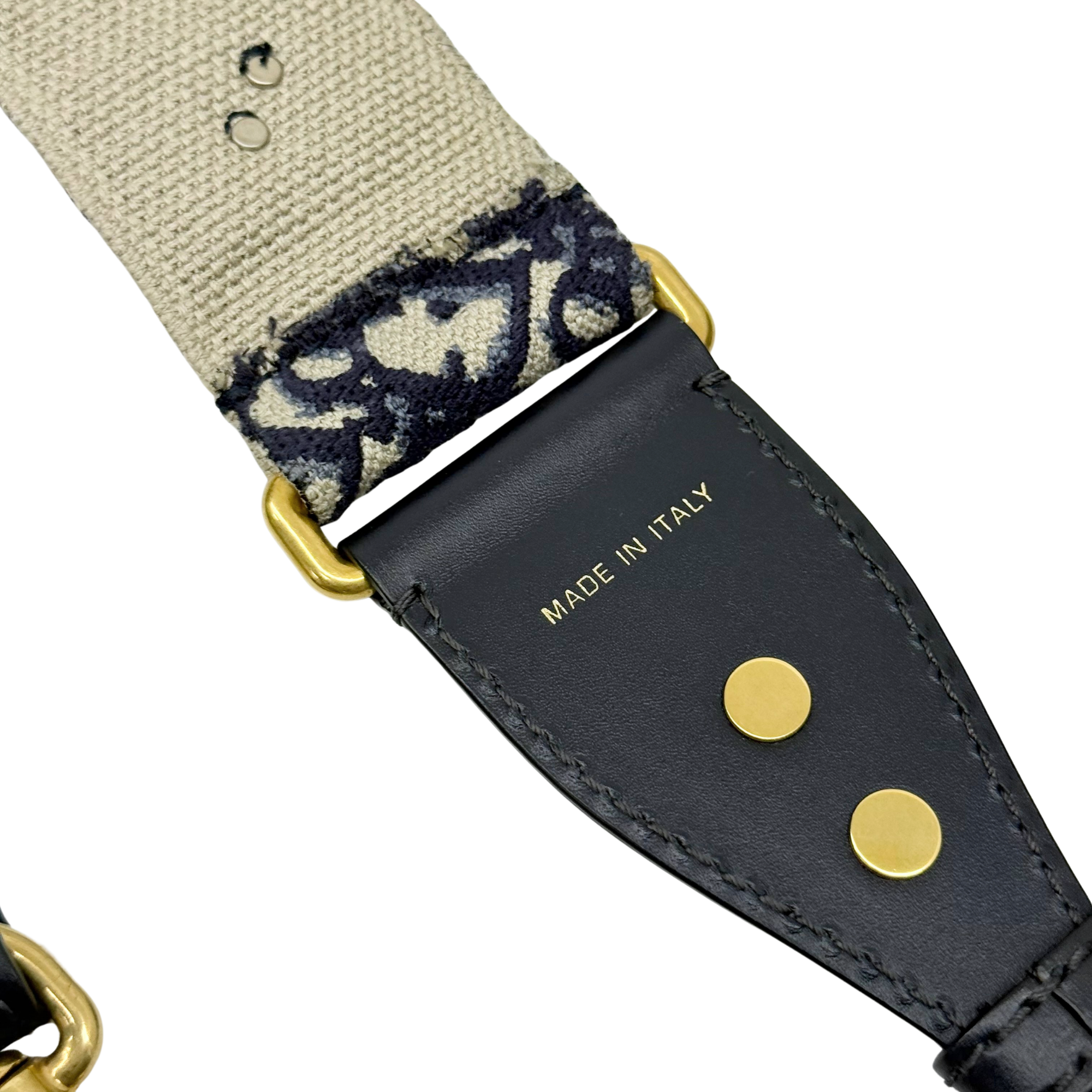 Leather strap end with MADE IN ITALY stamp and gold snap buttons