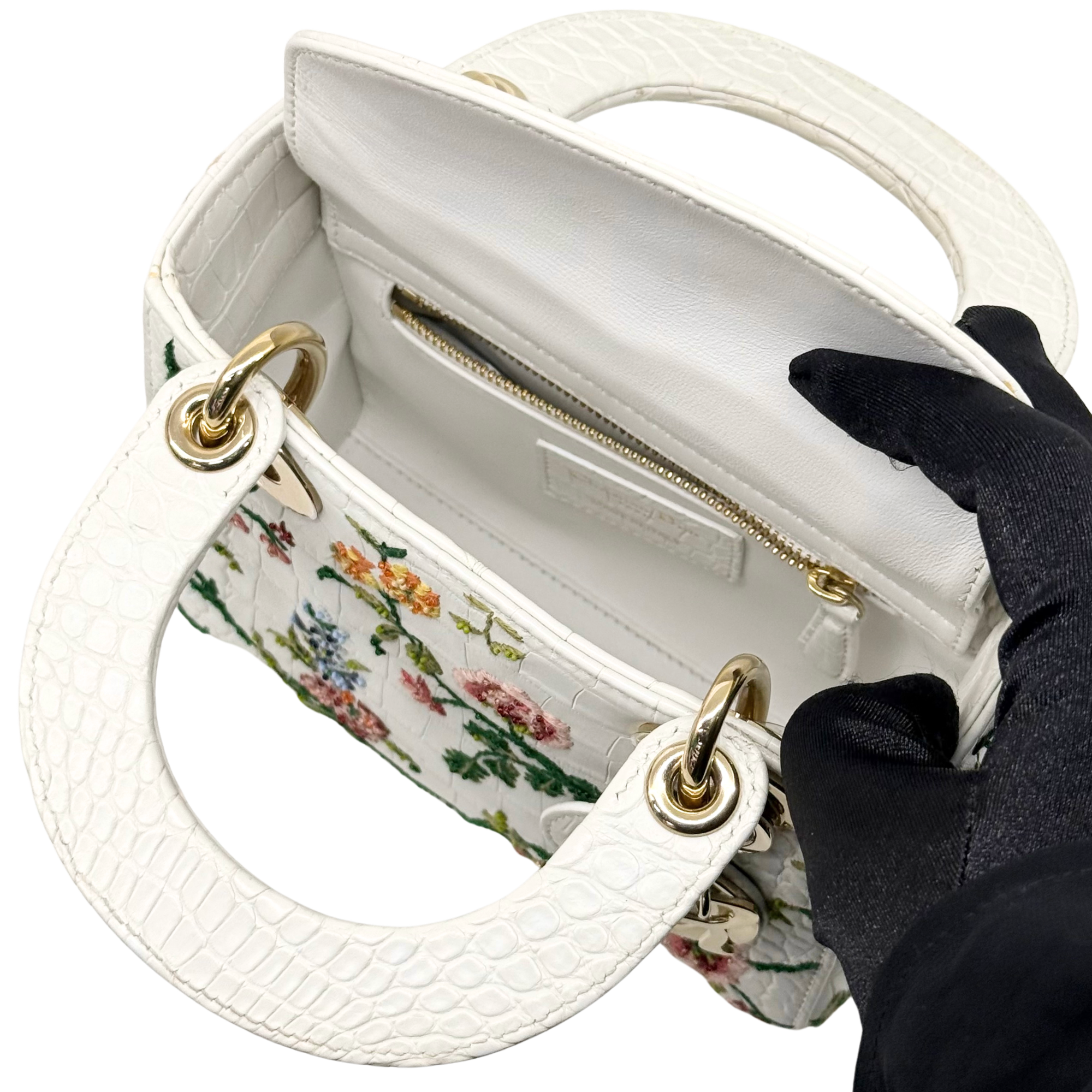 White floral mini handbag interior pocket with zip and gold trim hardware