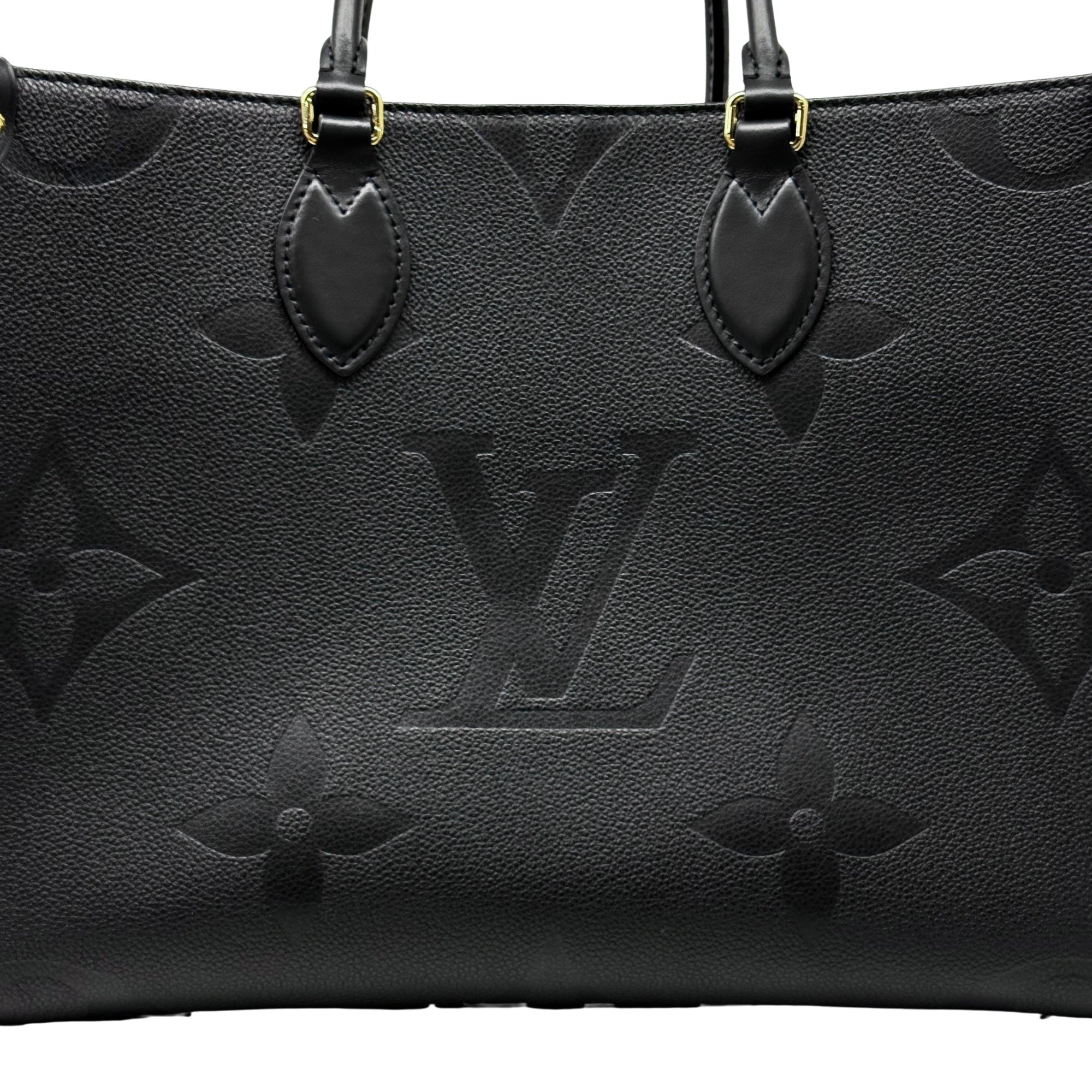 Pre-owned Louis Vuitton black monogram tote bag close-up of front panel and leather handle tabs