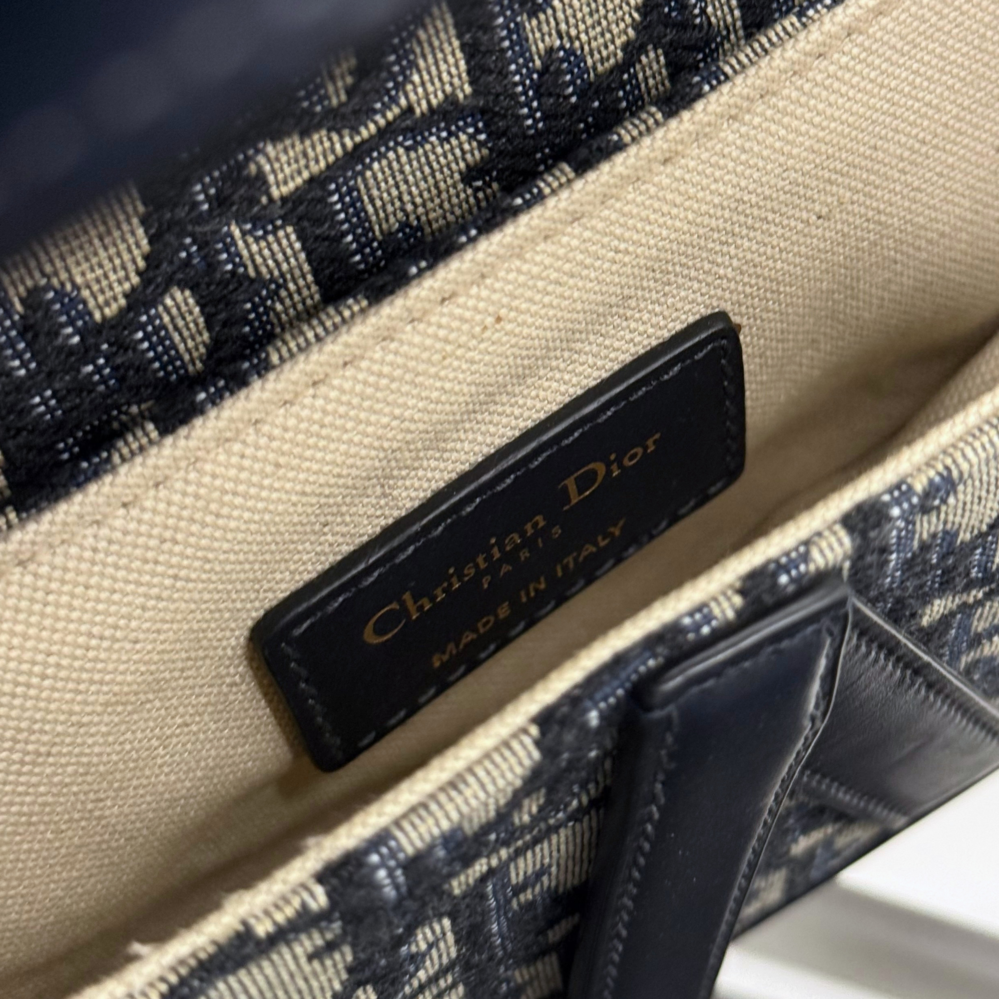 Leather interior label reading Dior and MADE IN ITALY
