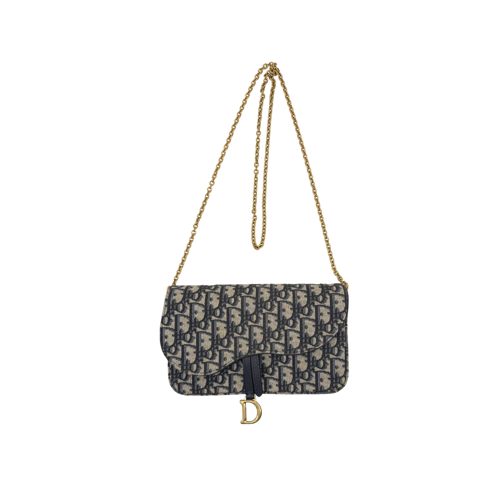 Dior monogram crossbody bag with flap front, adjustable shoulder chain, and gold D charm