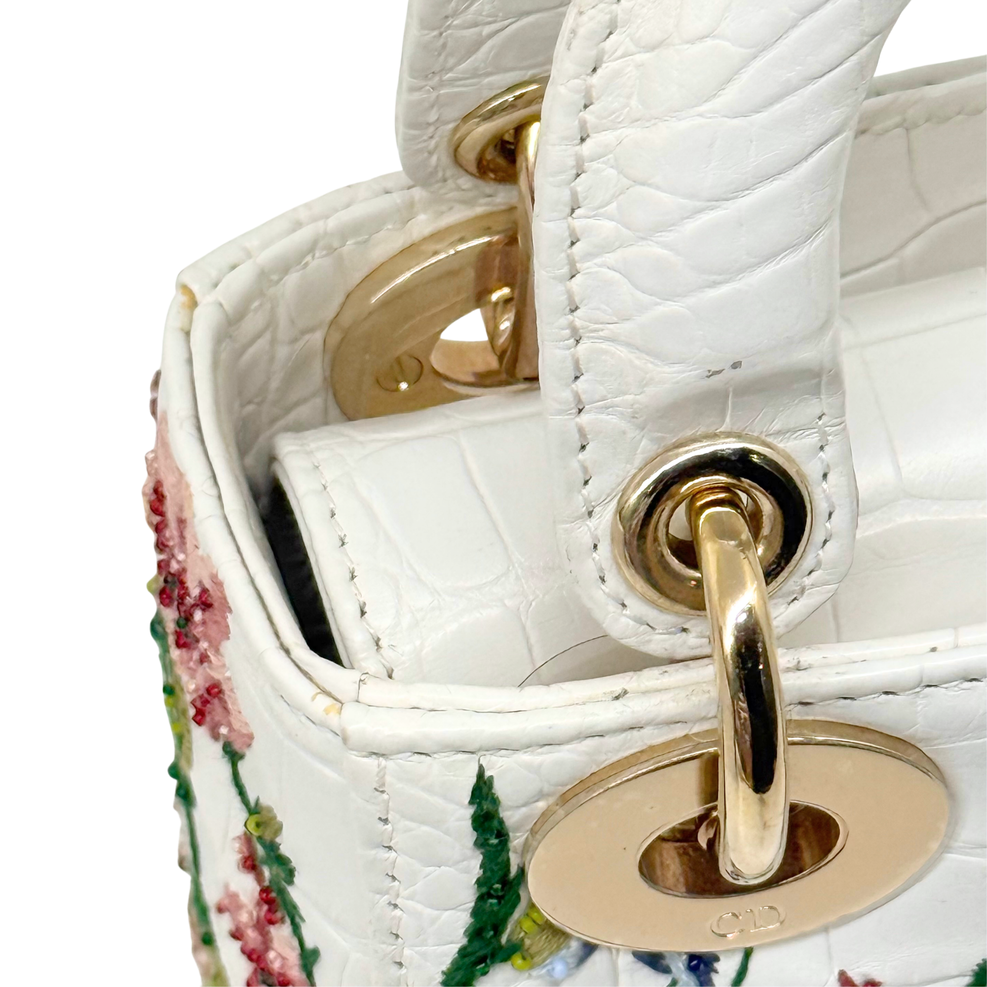 White leather mini handbag with gold turn-lock and chain ring hardware