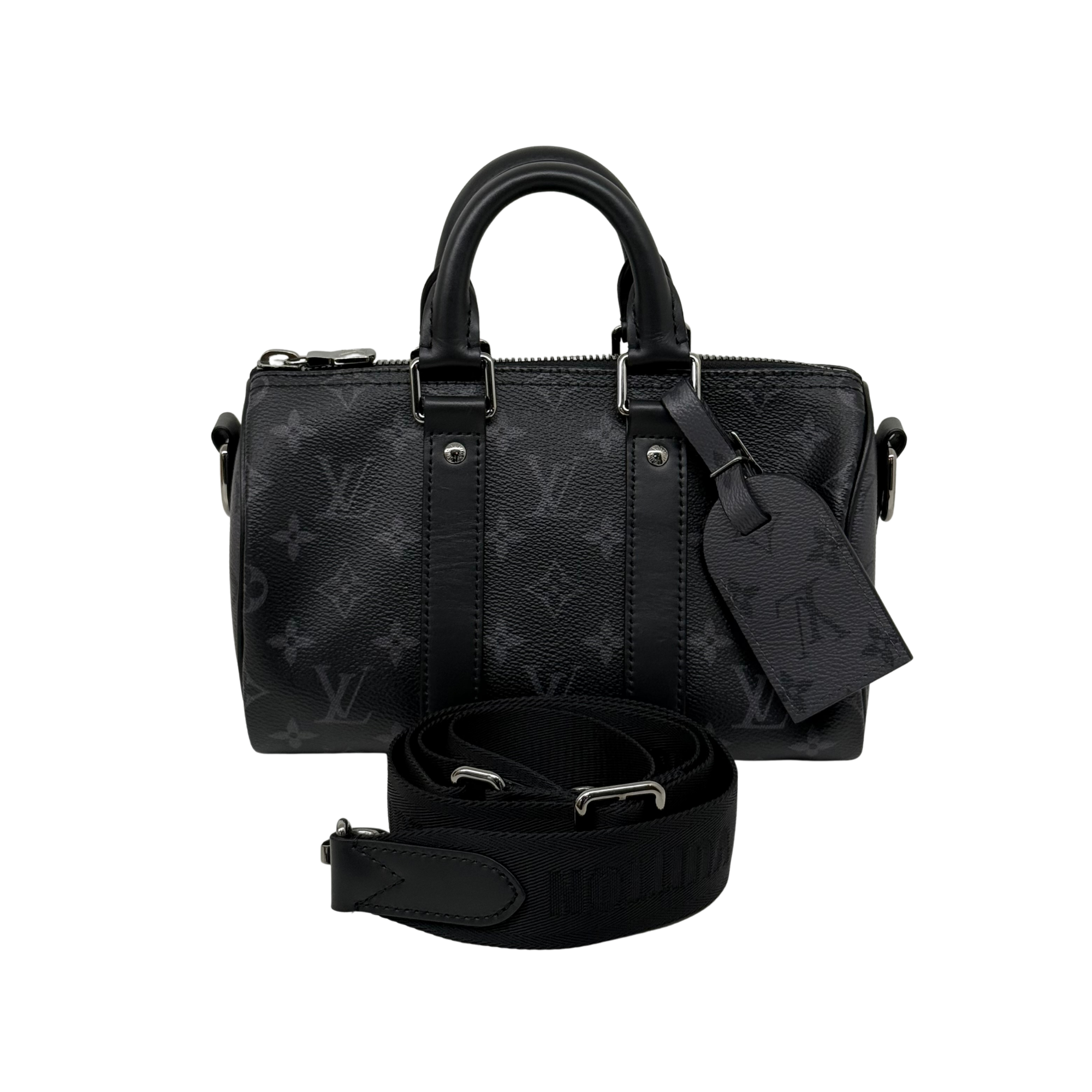 Black monogram handbag with top handles, zip closure, and crossbody strap