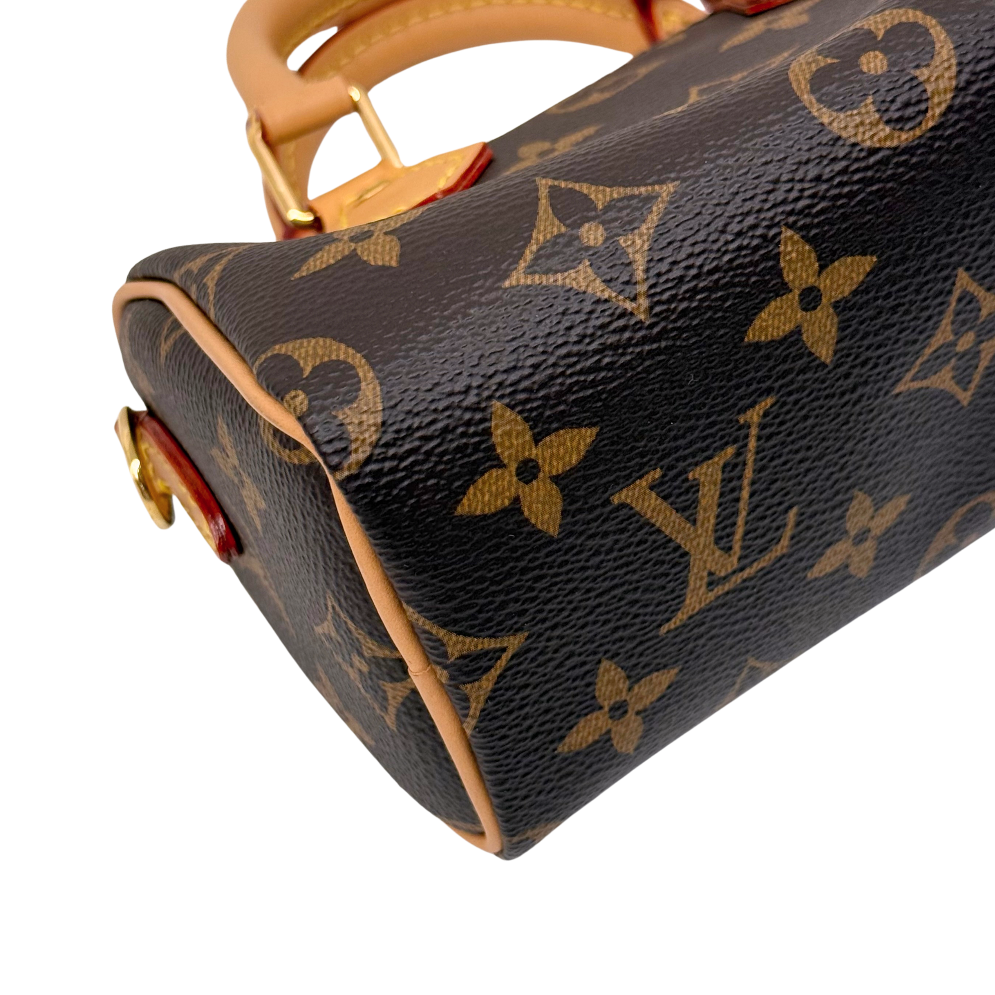 Louis Vuitton monogram canvas handbag side with tan leather trim and gold clasp