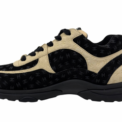 Black and beige Chanel sneaker upper close-up with lace eyelets and textured panels