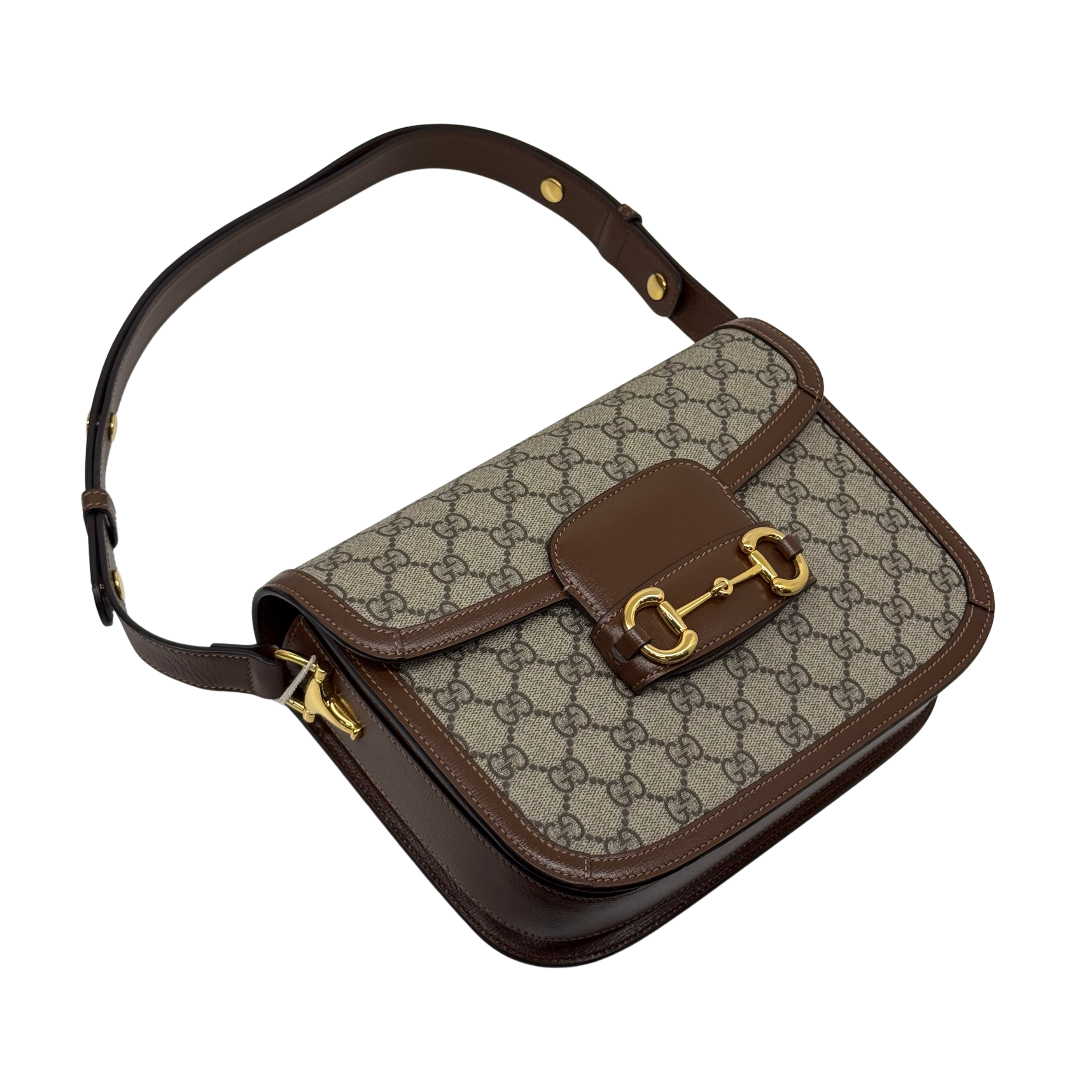 Pre-owned Gucci GG canvas crossbody bag with brown leather flap and gold buckle hardware