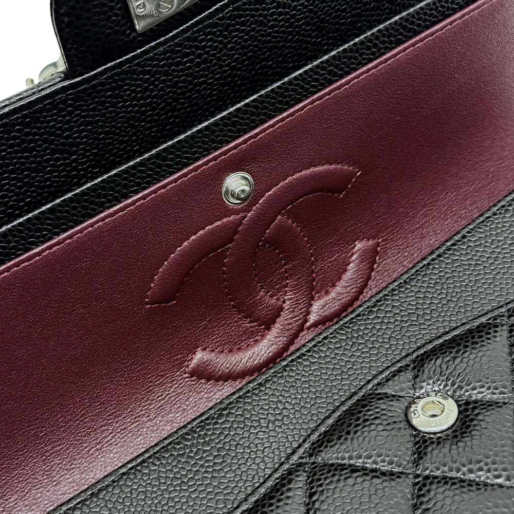 Burgundy leather panel with Chanel logo script and black stitched trim
