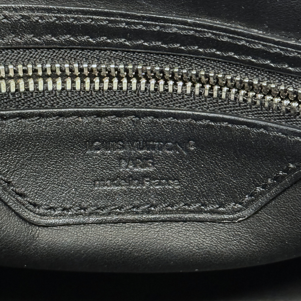 Louis Vuitton pre-owned bag interior leather pocket with zipper and stamped logo