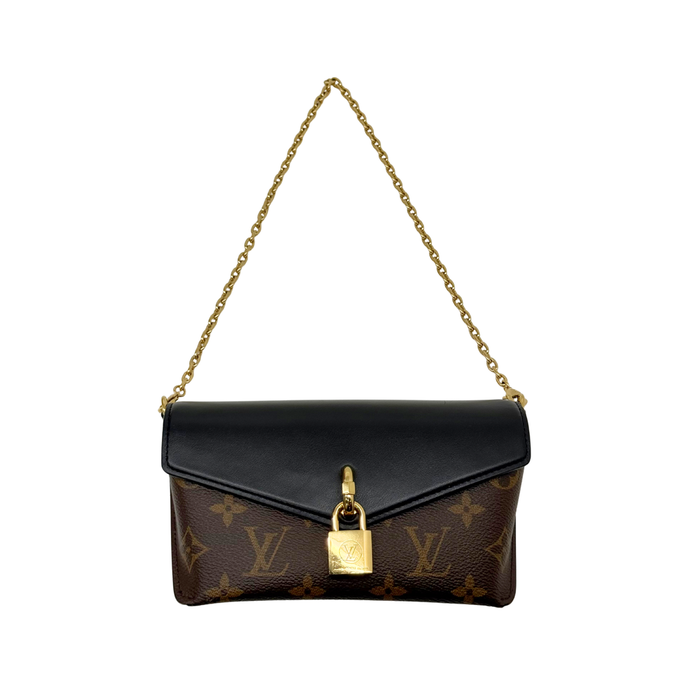 Small monogram shoulder bag with black flap, gold lock charm, and chain strap