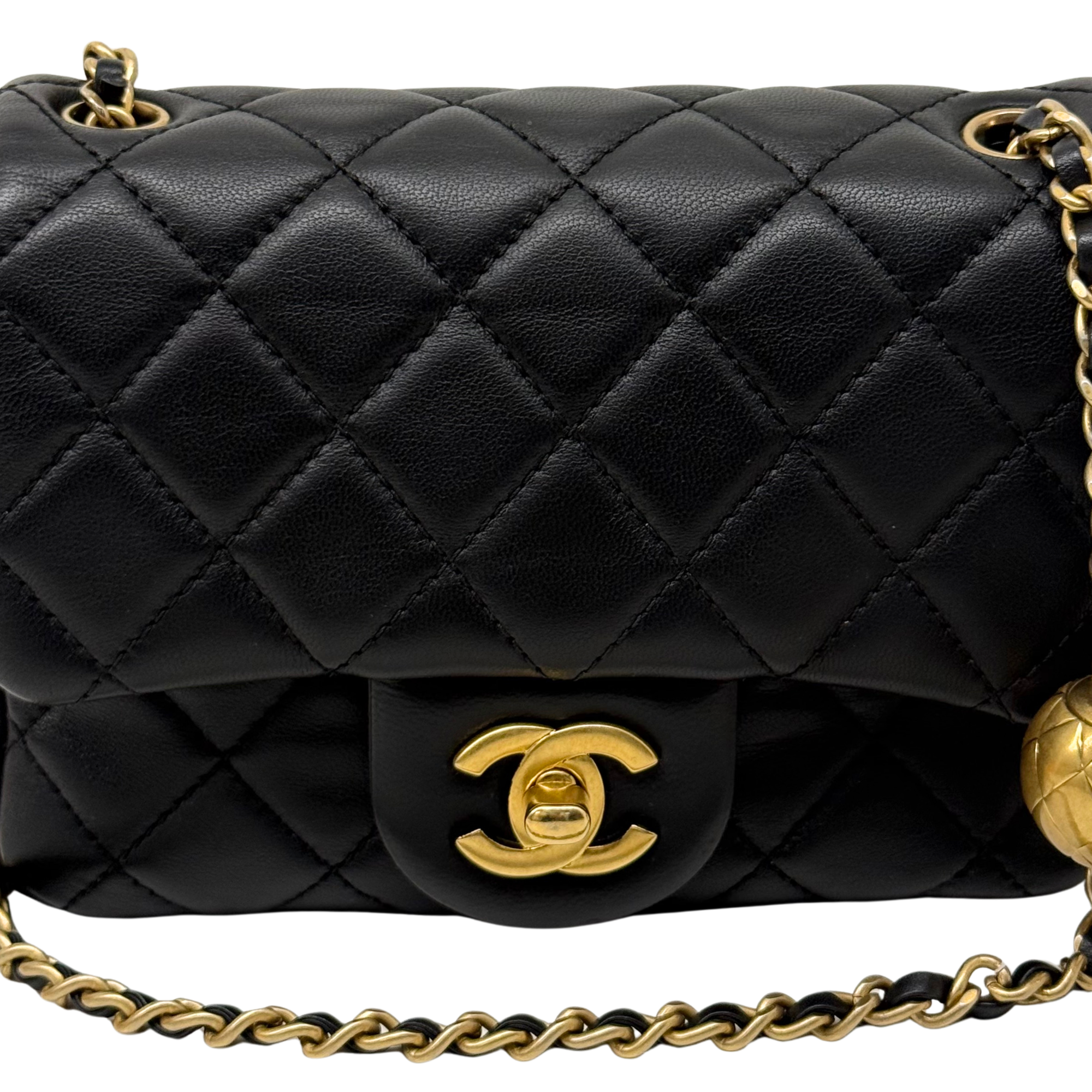 Black quilted flap shoulder bag with gold CC logo and braided chain strap
