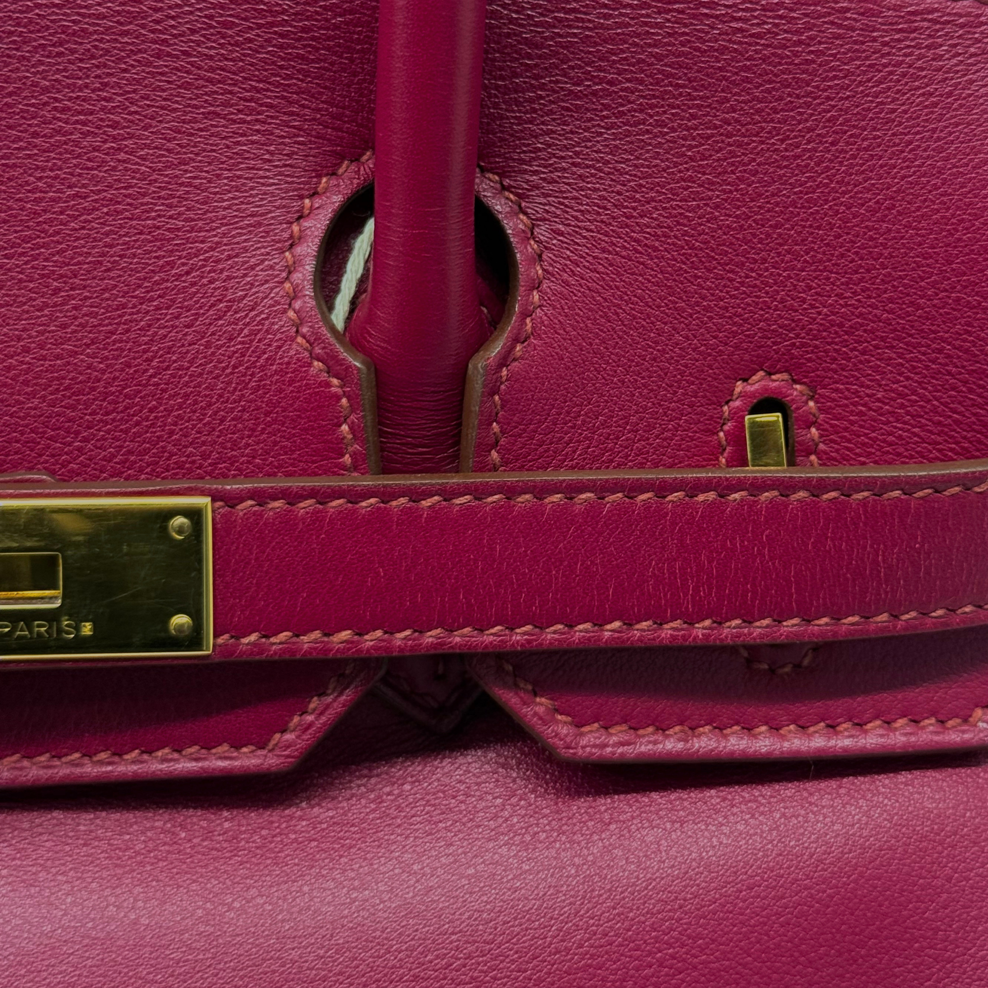 Hermès Birkin 30 magenta leather bag close-up of handle and turn-lock clasp