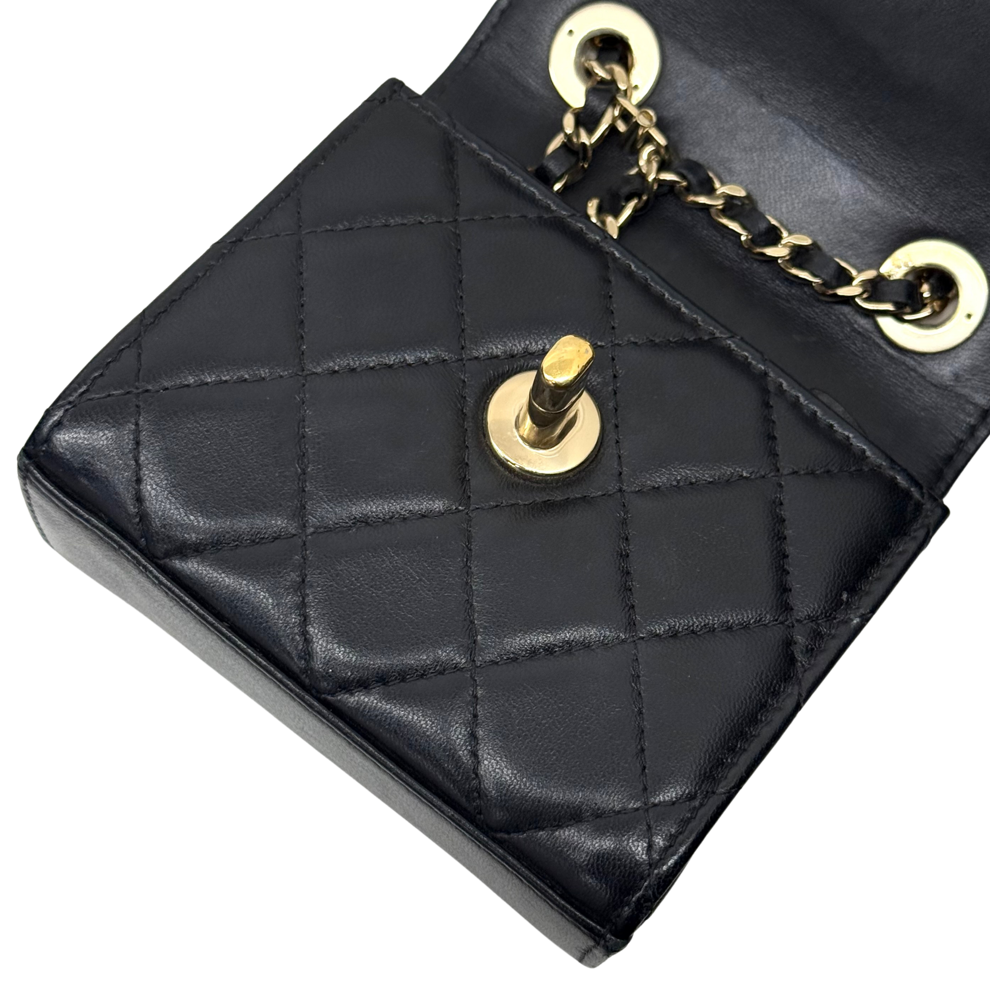 Black Chanel quilted mini flap bag with gold snap, CC hardware and chain strap