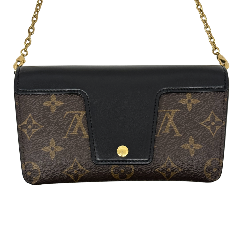 Monogram crossbody bag front with black center flap and gold button