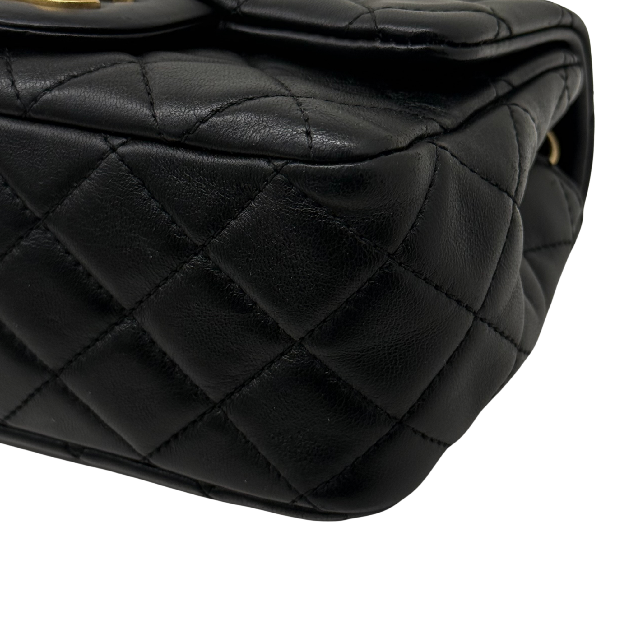 Pre-owned quilted shoulder bag side panel close-up with black leather diamond pattern