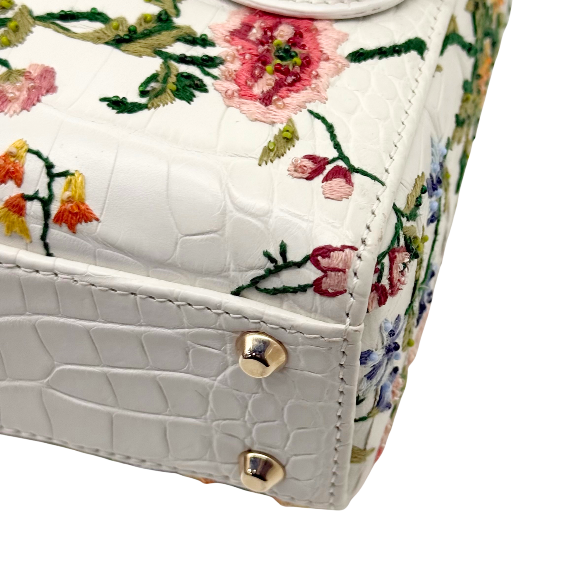 White leather mini handbag corner with floral embroidery and gold snap studs