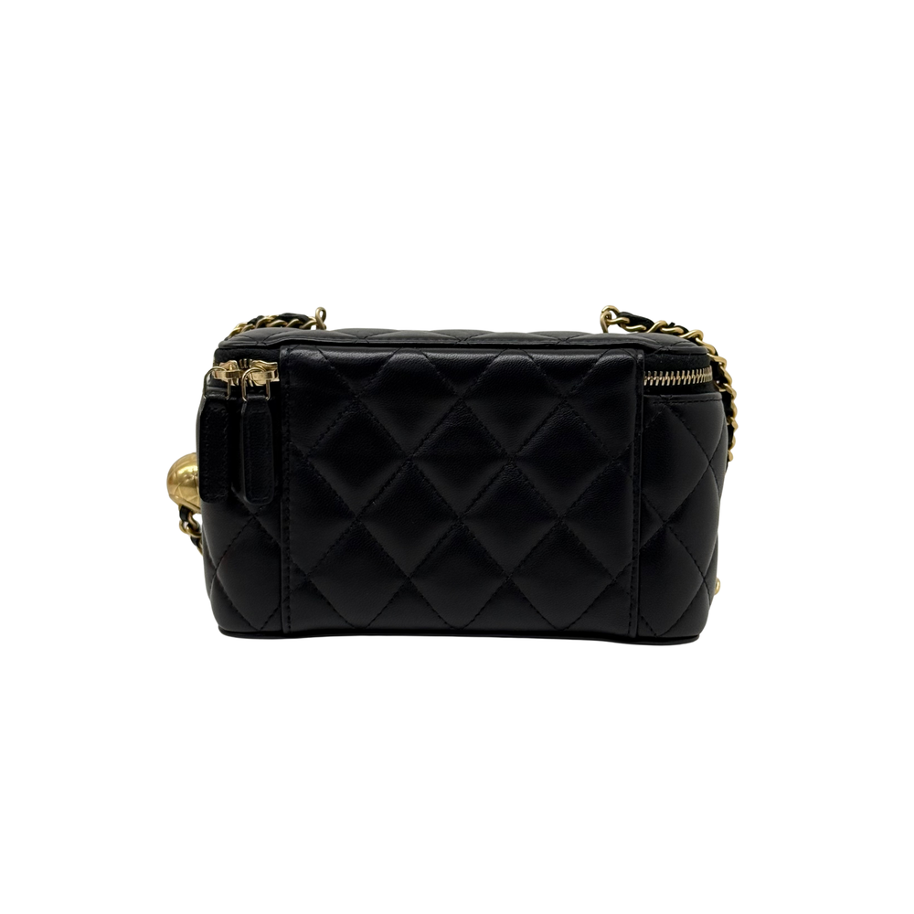 Black quilted leather crossbody with gold chain attachments and top zip