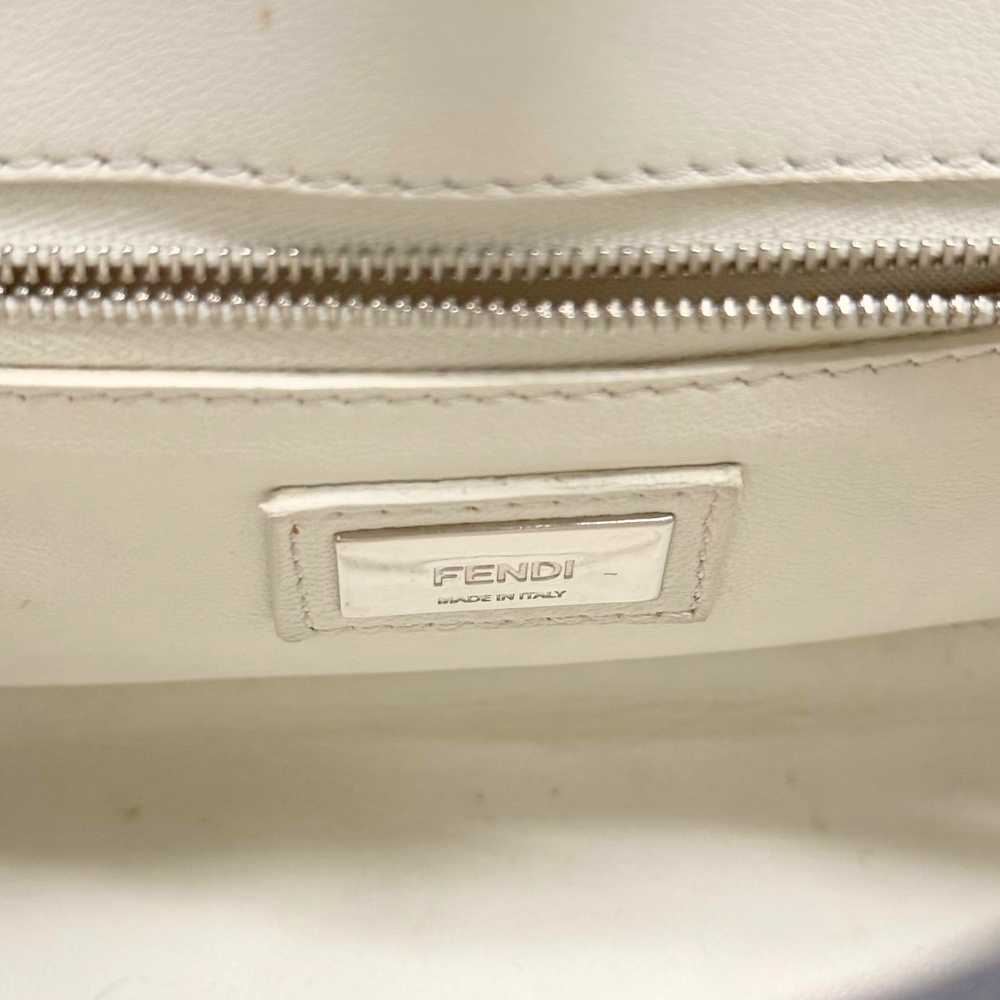 FENDI logo tag on light lining inside handbag with zipper