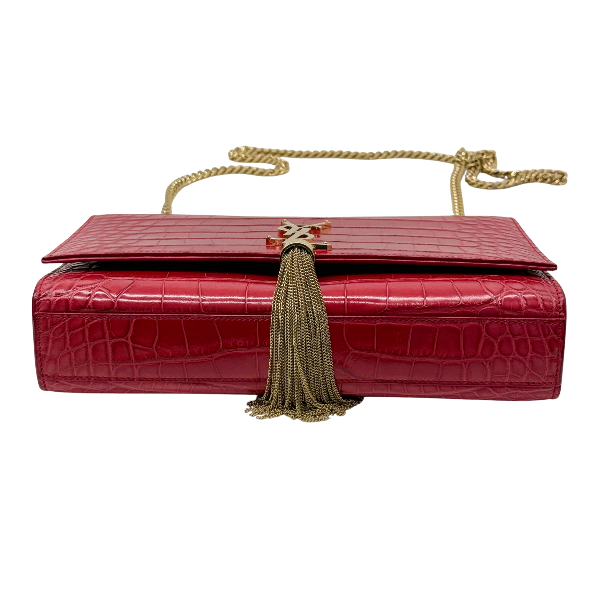 Red croc-embossed clutch with gold chain handles and hanging tassel