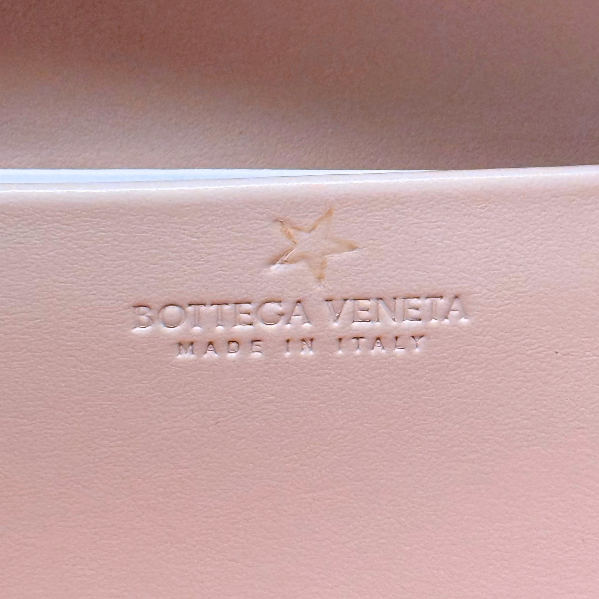 Bottega Veneta leather bag with embossed logo and Made in Italy mark