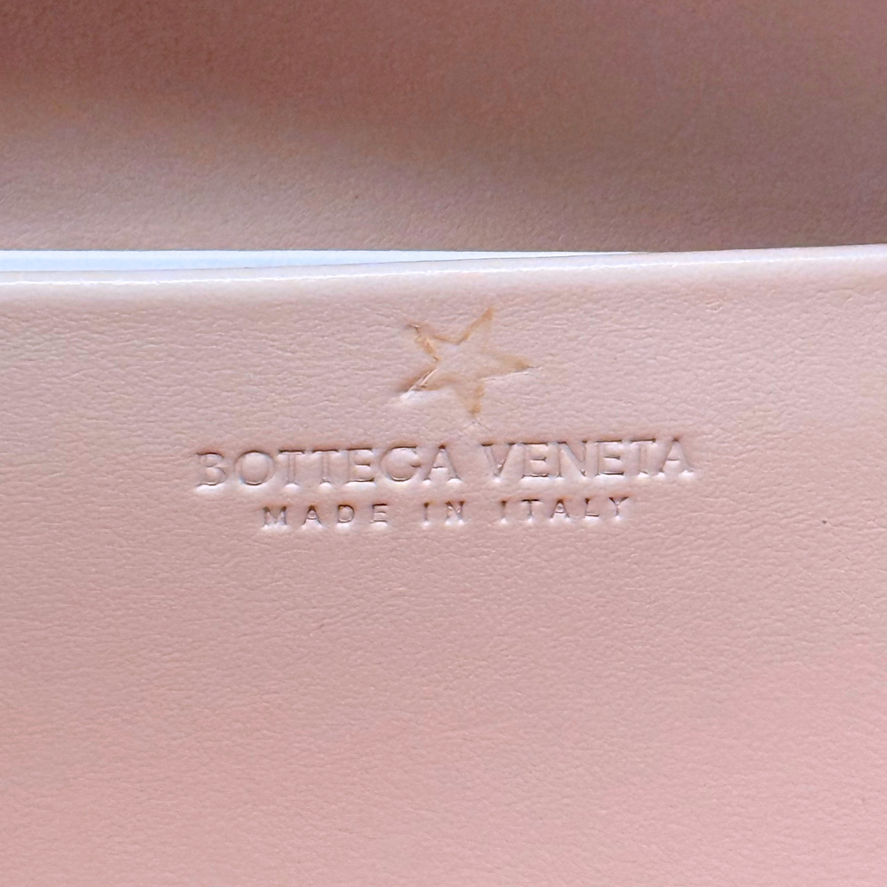 Bottega Veneta leather bag with embossed logo and Made in Italy mark